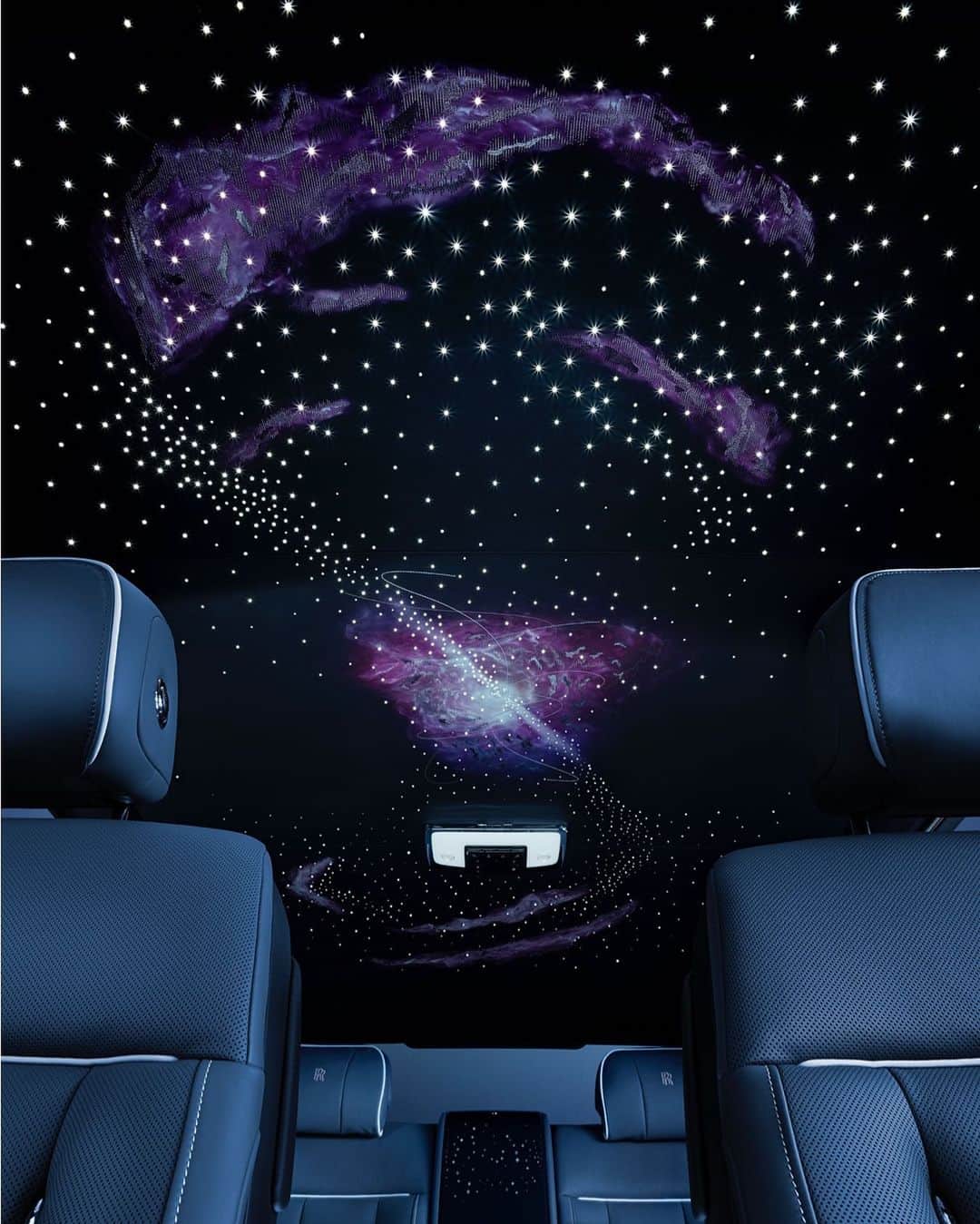 ロールス・ロイスのインスタグラム：「At the magnetic heart of #PhantomTempus is the Pulsar Headliner.  Hand-painted in the image of a pulsar star, this embroidered iteration of our iconic Starlight Headliner emits a mesmerising, cosmic glow.  Discover #PhantomTempus now; link in bio.   #RollsRoycePhantom  — NEDC (combined): CO2 emission: 329-328 g/km; Fuel consumption: 19.5-19.6 mpg / 14.5-14.4 l/100km. WLTP (combined): CO2 emission: 356-341 g/km; Fuel consumption: 18.0-18.8 mpg / 15.7-15.0 l/100km.」