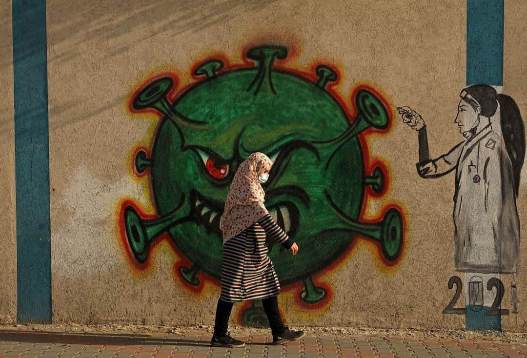 AFP通信さんのインスタグラム写真 - (AFP通信Instagram)「#AFPrepost @aljazeeraenglish - The coronavirus outbreak has inspired some graffiti artists to paint fun or informative works of art on public spaces. Here are some of the graffiti displayed across the globe: ⁠⁠⁣ ⁣  📸Photos: William West, Francisco Robles,  Ina Fassbender, Joseph Eid, Raul arboleda, Mohammed Abed, Mohd Rasfan, Andy Buchanan, Fadel Senna, Nelson Almeida, @afpphoto⁣ .⁠⁠⁣ 1. A woman looks at a mural of a health worker with wings holding a globe in Melbourne, Australia. ⁠⁠⁣ .⁠⁠⁣ 2. A man walks past a coronavirus-related mural, in Acapulco, Guerrero state, Mexico.⁠⁠⁣ .⁠⁠⁣ 3. A boy stands in front of a graffiti painted by artist Kai 'Uzey' Wohlgemuth featuring a nurse as Superwoman on a wall in Hamm, western Germany.⁠⁠⁣ .⁠⁠⁣ 4. A mural depicting a mask-clad boy in front of the Zouk Thermal Power Plant, north of the Lebanese capital Beirut. ⁠⁠⁣ .⁠⁠⁣ 5. A woman wearing a face mask walks next to a painted wall in Bogota, Colombia. ⁠⁠⁣ .⁠⁠⁣ 6. A Palestinian woman walks past a coronavirus-inspired mural in Gaza City. ⁠⁠⁣ .⁠⁠⁣ 7. A medical personnel wearing a protective suit waits at the Covid-19 coronavirus drive-thru test centre outside the Ajwa Private Clinic in Shah Alam on the outskirts of Kuala Lumpur, Malaysia. ⁠⁠⁣ .⁠⁠⁣ 8. A pedestrian walks past graffiti depicting the subjects within famous artworks in Glasgow. ⁠⁠⁣ .⁠⁠⁣ 9. A Moroccan man drives his horse-drawn cart past a mural thanking essential workers in the city of Sale north of the capital. ⁠⁠⁣ .⁠⁠⁣ 10. View of Brazilian mural artist Eduardo Kobra's recent work "Coexistence" which shows children wearing face masks bearing symbols of different religions (L to R) Islam, Buddhism, Christianity, Judaism and Hinduism- in Itu, some 100 km from Sao Paulo, Brazil. ⁠⁠⁣ .⁠⁠⁣ 🔗Tap the link in our bio to learn about how Graffiti tells the story of Egypt’s revolution.⁠⁠⁣ .⁠⁠⁣ #coronavirus #art #graffiti ⁠#health #malaysia #brazil #colombia #morocco #palestine #gaza #germany #lebanon #beirut #mexico #australia⁠⁠」2月25日 2時50分 - afpphoto