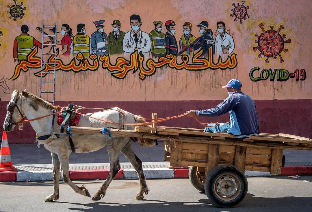 AFP通信さんのインスタグラム写真 - (AFP通信Instagram)「#AFPrepost @aljazeeraenglish - The coronavirus outbreak has inspired some graffiti artists to paint fun or informative works of art on public spaces. Here are some of the graffiti displayed across the globe: ⁠⁠⁣ ⁣  📸Photos: William West, Francisco Robles,  Ina Fassbender, Joseph Eid, Raul arboleda, Mohammed Abed, Mohd Rasfan, Andy Buchanan, Fadel Senna, Nelson Almeida, @afpphoto⁣ .⁠⁠⁣ 1. A woman looks at a mural of a health worker with wings holding a globe in Melbourne, Australia. ⁠⁠⁣ .⁠⁠⁣ 2. A man walks past a coronavirus-related mural, in Acapulco, Guerrero state, Mexico.⁠⁠⁣ .⁠⁠⁣ 3. A boy stands in front of a graffiti painted by artist Kai 'Uzey' Wohlgemuth featuring a nurse as Superwoman on a wall in Hamm, western Germany.⁠⁠⁣ .⁠⁠⁣ 4. A mural depicting a mask-clad boy in front of the Zouk Thermal Power Plant, north of the Lebanese capital Beirut. ⁠⁠⁣ .⁠⁠⁣ 5. A woman wearing a face mask walks next to a painted wall in Bogota, Colombia. ⁠⁠⁣ .⁠⁠⁣ 6. A Palestinian woman walks past a coronavirus-inspired mural in Gaza City. ⁠⁠⁣ .⁠⁠⁣ 7. A medical personnel wearing a protective suit waits at the Covid-19 coronavirus drive-thru test centre outside the Ajwa Private Clinic in Shah Alam on the outskirts of Kuala Lumpur, Malaysia. ⁠⁠⁣ .⁠⁠⁣ 8. A pedestrian walks past graffiti depicting the subjects within famous artworks in Glasgow. ⁠⁠⁣ .⁠⁠⁣ 9. A Moroccan man drives his horse-drawn cart past a mural thanking essential workers in the city of Sale north of the capital. ⁠⁠⁣ .⁠⁠⁣ 10. View of Brazilian mural artist Eduardo Kobra's recent work "Coexistence" which shows children wearing face masks bearing symbols of different religions (L to R) Islam, Buddhism, Christianity, Judaism and Hinduism- in Itu, some 100 km from Sao Paulo, Brazil. ⁠⁠⁣ .⁠⁠⁣ 🔗Tap the link in our bio to learn about how Graffiti tells the story of Egypt’s revolution.⁠⁠⁣ .⁠⁠⁣ #coronavirus #art #graffiti ⁠#health #malaysia #brazil #colombia #morocco #palestine #gaza #germany #lebanon #beirut #mexico #australia⁠⁠」2月25日 2時50分 - afpphoto