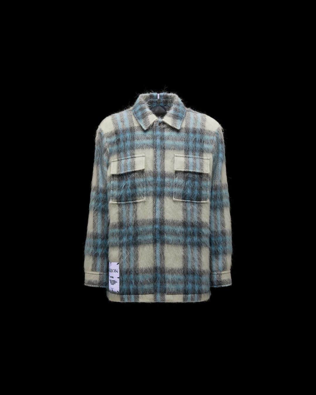 マックキュー アレキサンダー・マックイーンのインスタグラム：「The Coat Overshirt is made from soft protective wool and covered in aligned check. This transseasonal piece retains warmth with internal diamond quilting and features functional details such as front patch pockets.   Available now in 100 selected stores worldwide and on GOAT.COM.」