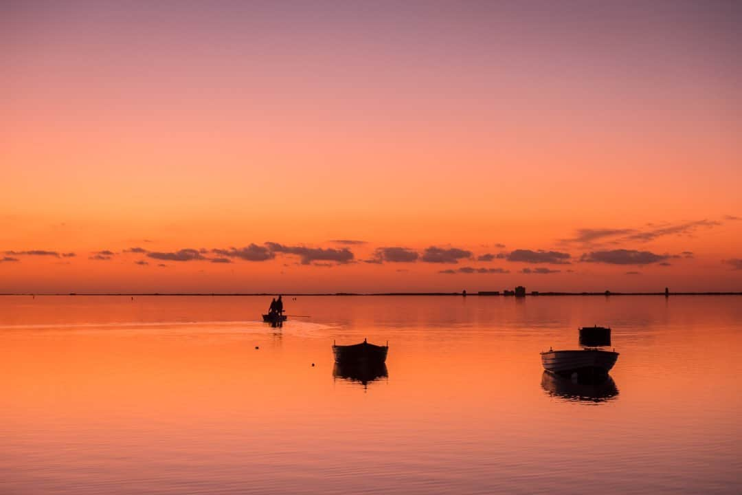 National Geographic Travelさんのインスタグラム写真 - (National Geographic TravelInstagram)「Photo by @francescolastrucci / Two fishermen leave at sunset in the Stagnone Nature Reserve, which takes its name from the lagoon on the northern shore of the town of Marsala on the westernmost tip of Sicily. This magical place is one of the best spots in Italy to watch sunsets. The stunning landscape, with its ever changing colors, scents, and salt pans, is a natural habitat for many species of fish and birds attracted by its calm, shallow, and warm waters. The area has been strategically important since ancient times, particularly in the Phoenician and Roman eras and at the time of the Spanish domination in the 15th century, when salt pans were built along its coast.  Follow me @francescolastrucci for more places, daily life, and stories around the world. #sicily #italy #environment #landscapephotography」2月26日 12時35分 - natgeotravel