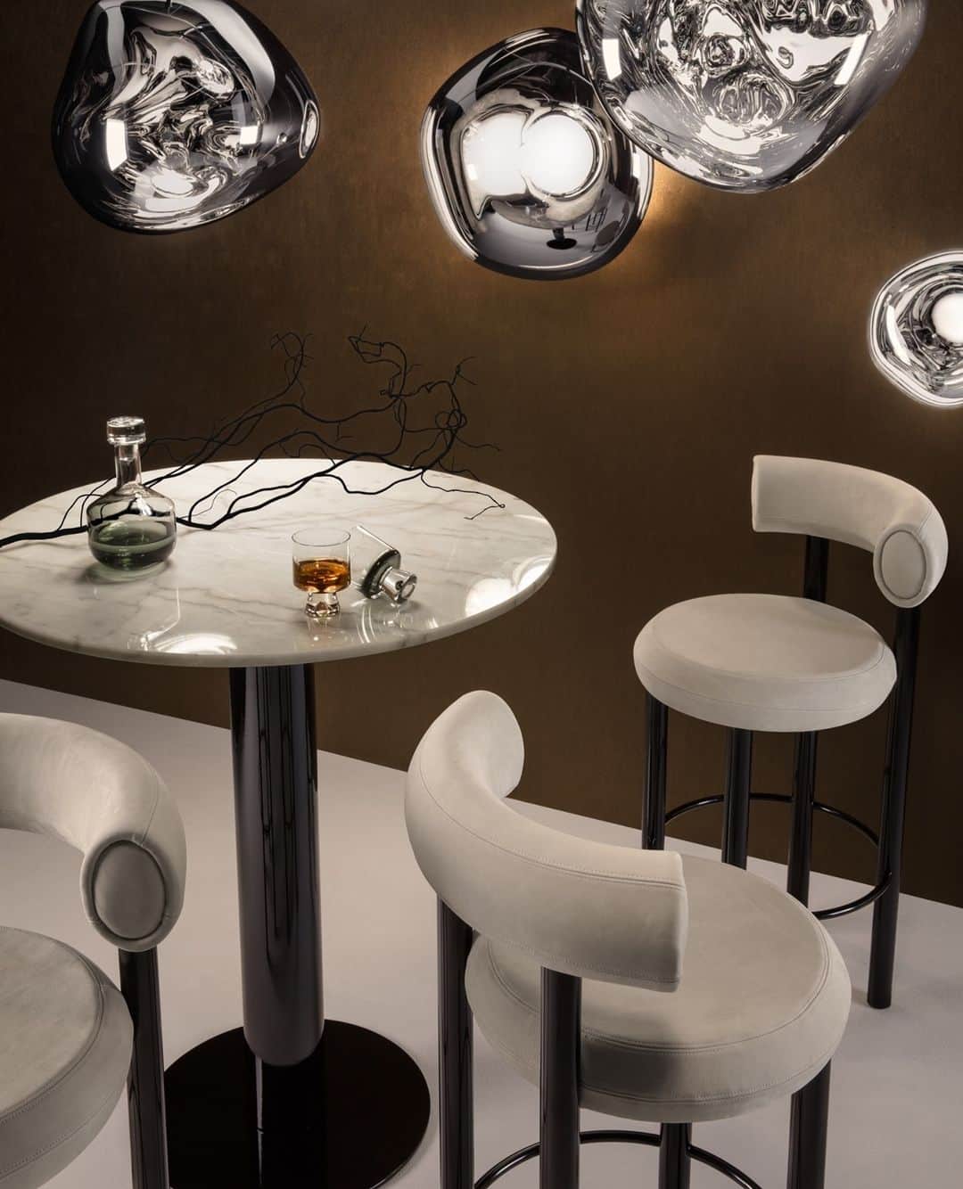 のインスタグラム：「Tom Dixon's FAT bar stool with the TUBE high table and MELT lights.⁠ ⁠ The extreme simplicity of FAT's components is a testament to form following function, whilst maintaining a humorous silhouette and a reductionist aesthetic. ⁠」