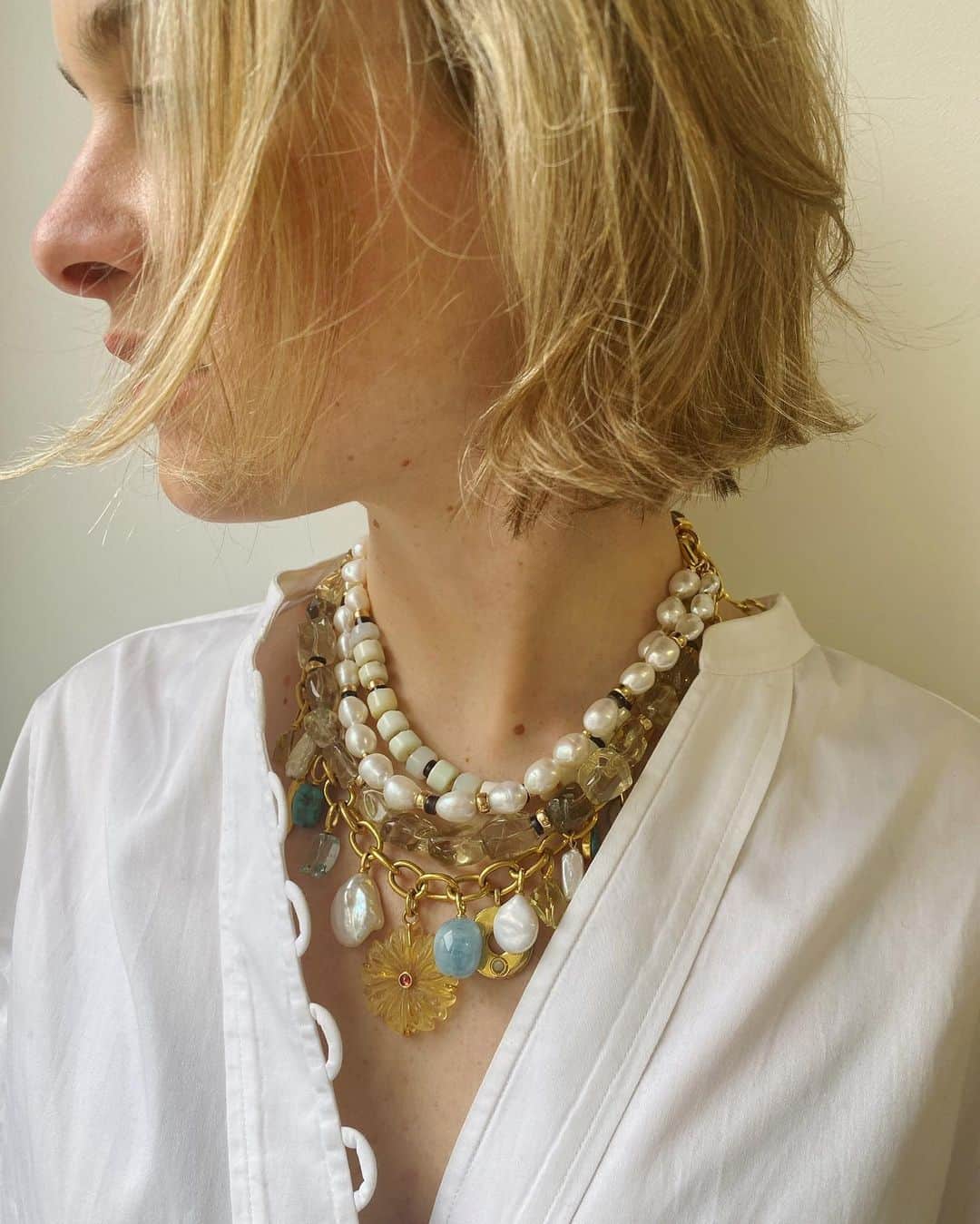 リジー フォルトゥナートのインスタグラム：「The sunniest, freshest, most elegant neck mess for Spring 👆🍋🌼🌞 The Golden Eye Necklace, with its layers of gold chain, pearls, lemon quartz and citrine, aquamarine and turquoise charms IS our statement of the new collection 〰️ The stones are semiprecious and we didn’t produce too many of this beauty, so don’t wait ⚡️#lizziefortunato」