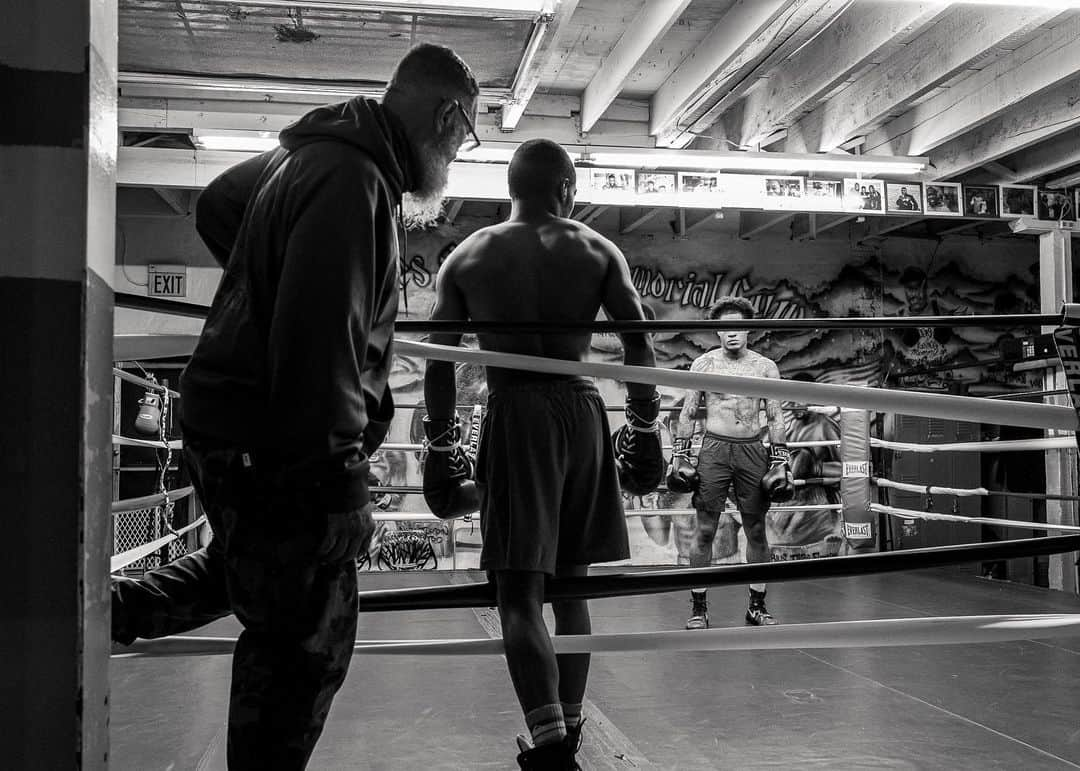 National Geographic Creativeさんのインスタグラム写真 - (National Geographic CreativeInstagram)「Photos by Walé Oyéjidé @ikirejones / Somewhere in Philadelphia, two gloved assailants approach each other from opposite corners of a ring. For one furious round, the city’s ubiquitous orchestra of sirens, dirt bike convoys, and Water Ice trucks, will be quietened as onlookers stare with the attention of devoted Mass-goers. It’s silent as a confessional; save for the landing of blows and the bold encouragement of over-eager coaches. In that small ring, punches and counterpunches serve as counter-intuitive ways to heal those who were on the verge of being broken, those with homes in disarray, and those who live in comfort; but nevertheless, need an escape. Outside, the news laments a pandemic. But here, among the fighters, the ring sings of peace.   This work is supported by the @insidenatgeo COVID-19 Emergency Fund for Journalists.   Follow me @ikirejones for celebrations of beauty in all its forms.」5月1日 0時58分 - natgeointhefield