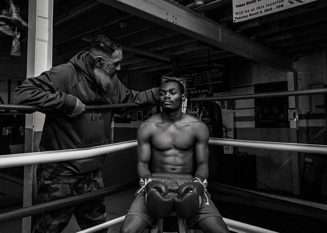 National Geographic Creativeさんのインスタグラム写真 - (National Geographic CreativeInstagram)「Photos by Walé Oyéjidé @ikirejones / Somewhere in Philadelphia, two gloved assailants approach each other from opposite corners of a ring. For one furious round, the city’s ubiquitous orchestra of sirens, dirt bike convoys, and Water Ice trucks, will be quietened as onlookers stare with the attention of devoted Mass-goers. It’s silent as a confessional; save for the landing of blows and the bold encouragement of over-eager coaches. In that small ring, punches and counterpunches serve as counter-intuitive ways to heal those who were on the verge of being broken, those with homes in disarray, and those who live in comfort; but nevertheless, need an escape. Outside, the news laments a pandemic. But here, among the fighters, the ring sings of peace.   This work is supported by the @insidenatgeo COVID-19 Emergency Fund for Journalists.   Follow me @ikirejones for celebrations of beauty in all its forms.」5月1日 0時58分 - natgeointhefield