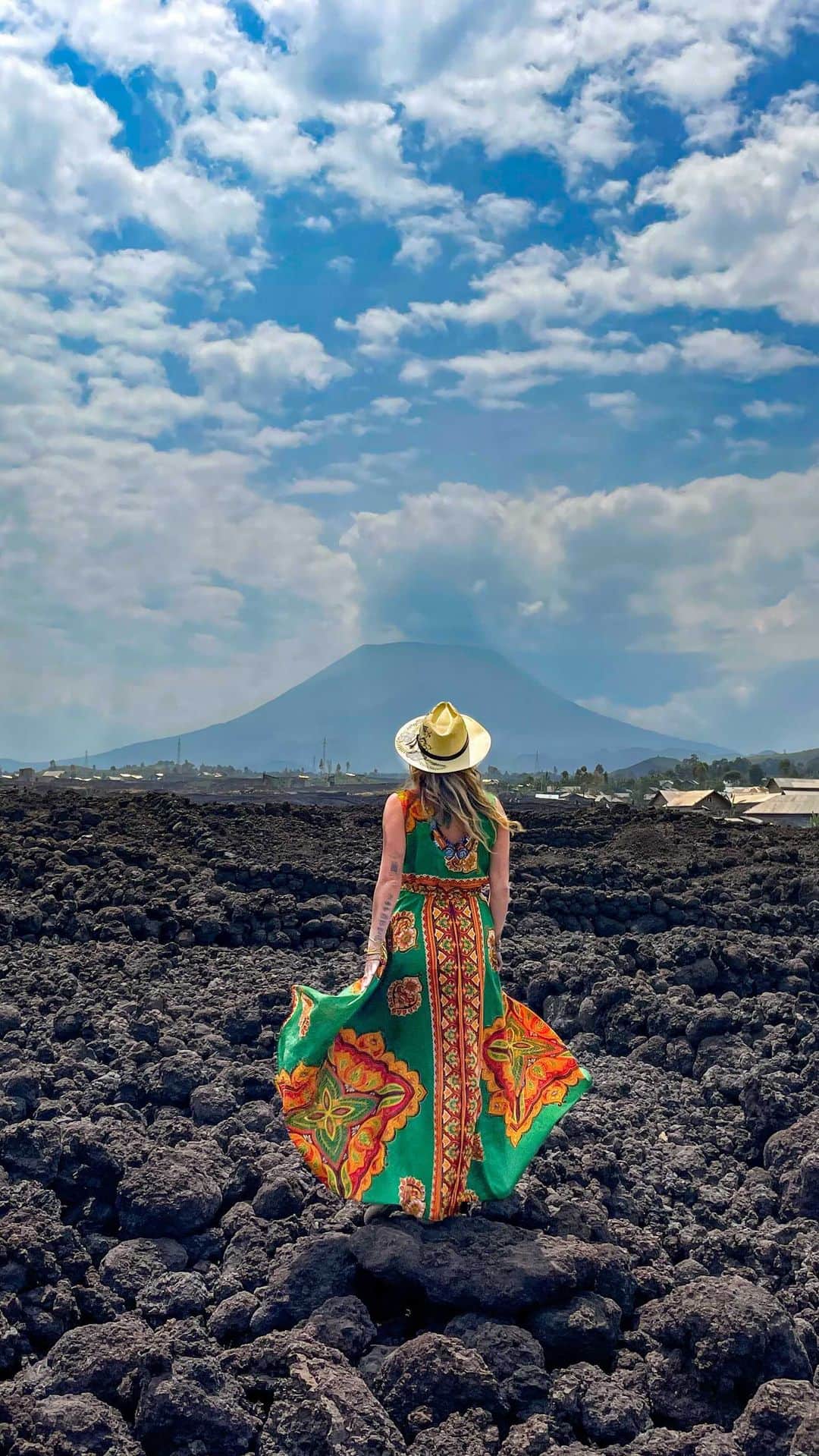 アリサ・ラモスのインスタグラム：「Originally my plans in D.R. Congo included hiking and camping on the rim of Nyiragongo, overlooking the lava pools of this active volcano.  Two months before my trip, it erupted, and I found out via my soon-to-be-guide, Obed’s IG Stories. I was terrified for his safety, and heartbroken for the people who lost their homes & are now displaced.  Obed was actually ON Nyiragongo when it erupted. He said luckily the lava moved slowly, because despite destroying thousands of homes, it at least gave the occupants time to flee.   No one saw this eruption coming. Not even scientists. Hearing the stories of people who were there’s experience was mind blowing. From the rangers in Virunga with an eye-level view, who did their best to call people in town to warn them, to the UN peacekeepers I met who looked outside when power went out to see a red sky.  I count myself as lucky that I wasn’t there, and actually had planned on my trip being cancelled, but Obed insisted I still come, and I’m so glad I did.  Witnessing this level of damage, walking on the still-hot jagged lava rocks that the locals can’t move or build on yet, really further pushed my desire to keep promoting tourism in this beautiful country.  I know I’ve said it repeatedly, but your tourism presence and dollars go a long way in places like Congo.  You can help a lot of people just by coming here to visit, shopping in the local markets, visiting the national parks, and donating directly to locals who lost their homes or organizations funding building projects.   I know not everyone is ok with just giving money, which is why I am now including a $100 donation with any of my group trips to Congo (which means so far we are donating minimum $1400 so far!), and working to create a fundraiser where donations can be wired and sent through Obed for direct delivery.  Speaking of Obed! I am so incredibly proud of him for finishing getting his book, ‘Kumbukumbu’ published to Kindle during our trip!  Please read this man’s story about 10 years as a Congolese refugee, which tells the true story of colonization and its horrific aftermath. Learn from the locals who lived it, not the foreigners who observed it. Link in stories💖」