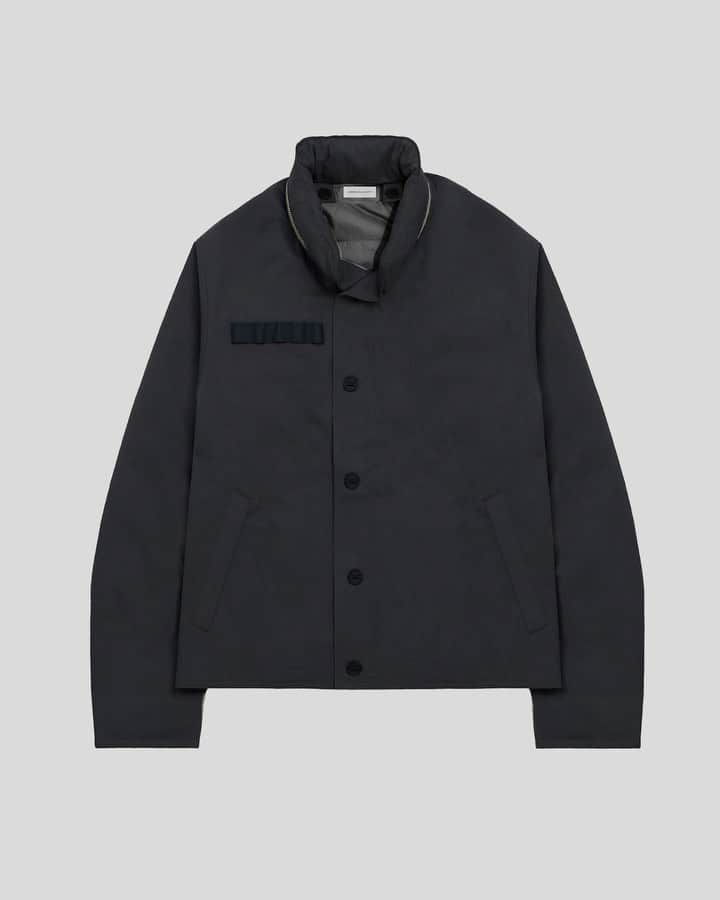 ジョン エリオットのインスタグラム：「The N-1 Deck Jacket takes cues from a clothing system developed by the US Navy, circa the 1940's. Featuring heavyweight military oxford fabric that's been washed for an aged look and hand, design elements include a button-closure storm flap, fullzip closure, webbing tape at the chest, and two side entry zip pockets. A hood is concealed within a zip closure at the collar. ThermoLite fill has been added between the outer face and interior.   The Liner, available as an optional purchase, is quilted and also filled with ThermoLite. It fastens into the Deck Jacket through buttons at the shoulders and zips at the front. As stand-alone pieces, both are well insulted. Worn together, the kit provides substantial warmth.  Available tomorrow at 8AM PST through johnelliott.com and in-store at our Flagship locations.」