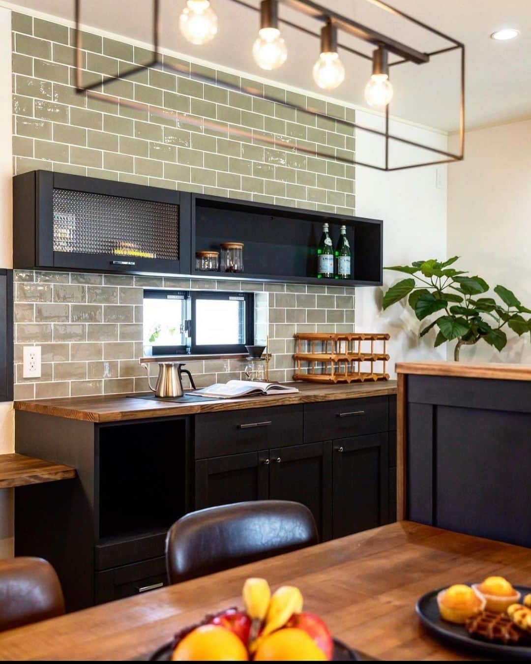 インテリアショップとつくる家 ZEST houseさんのインスタグラム写真 - (インテリアショップとつくる家 ZEST houseInstagram)「キッチン本体は木の質感を活かし、背面の食器棚は濃いグレー塗装を施しカッコよく仕上げたSさん家のキッチン空間。 食器棚背面に貼った緑がかったグレーのタイルもオリジナリティ溢れる空間づくりに一役買ってます★ ↩︎ ↩︎  ------------------------------------ ★資料請求 家づくりの資料請求はこちらから ↓↓↓ @zest_design_house_info ↩︎ ↩︎ ------------------------------------ ↩︎ ------------------------------------ ★もっと施工事例を見たい方はこちら ↓↓↓ ゼスト倉敷オフィス(岡山県) @zest_design_house ↩︎ ↩︎ ------------------------------------ ↩︎ ↩︎ #キッチン収納 #食器棚 #男前インテリア #キッチン雑貨 #ナチュラルキッチン #カフェ風インテリア #カフェ風 #注文住宅 #家づくり #木の家 #工務店 #マイホーム #マイホーム計画 #リノベーション #岡山工務店  #ゼスト倉敷 #インテリアショップとつくる家 #デザイン住宅 #新築マイホーム  #シンプルインテリア #自然素材の家 #オーダー家具 #かっこいい家 #かわいい家  #シンプルホーム #ダイニングテーブル #ダイニングチェア #ダイニング照明 #インダストリアルインテリア #カップボード」10月1日 18時20分 - zest_design_house