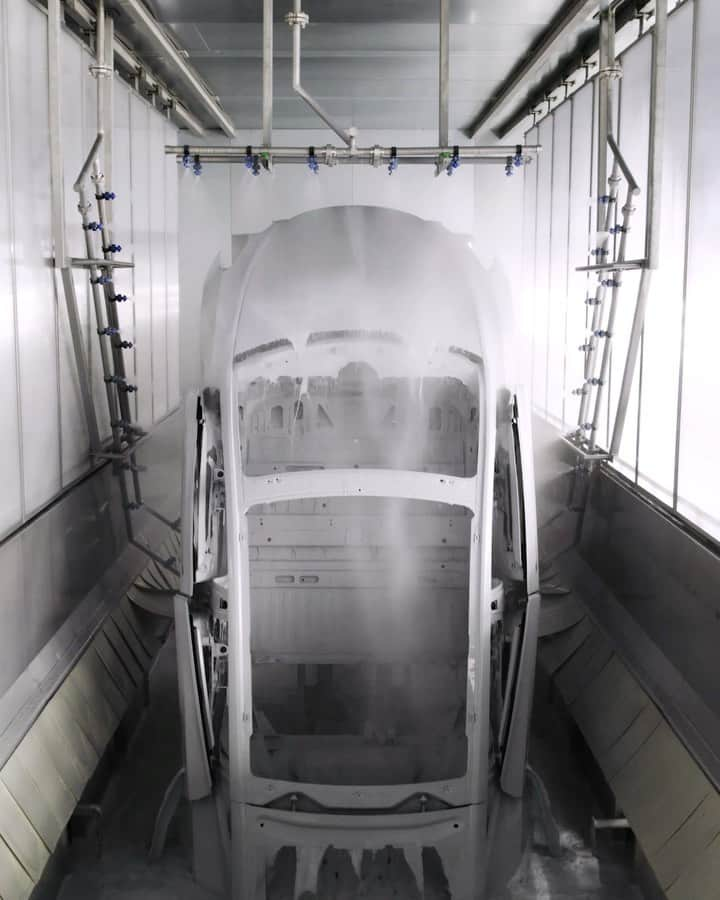 Teslaのインスタグラム：「After dipping the car in a cleaning bath, we electrically apply a coating to prevent corrosion when on the road」