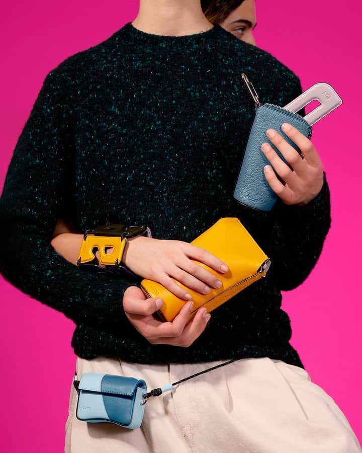 エコーのインスタグラム：「Are you looking for a #ValentinesDay gift?   The @eccoleathergoods mini bag is the perfect gift for a special someone. Check the V-Day Gift Edit for small and functional bags they'll LOVE.  Photography by @blommersschumm  Featured: ECCO Hybrid Pot Bag in Marigold, ECCO Textureblock Midi Pouch in China Blue. ECCO Textureblock Pinch Bag Mini in Light Sky/China Blue, ECCO Alphabet Charm in Marigold worn as a custom bangle.  #eccoleathergoods #ToolsToLiveFreely​」