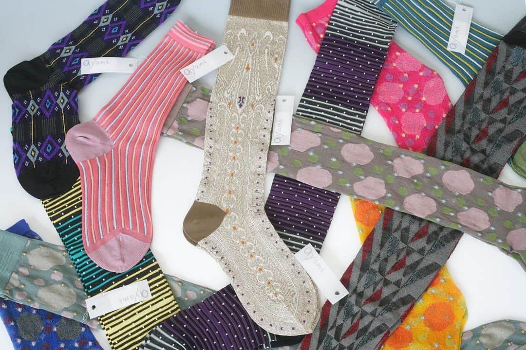 アヤメのインスタグラム：「Ayame just turned 15 years old🧦🎉 This image is the first collection in 2007🇯🇵 #since2007  AYAME靴下15周年でした🥂月並みですが、皆様ありがとうございます。会社員時代も合わせると靴下デザイナー歴が20年になりました。写真はデビューコレクションの写真です。カメラの会社に勤めている友人に借りたカメラで自分で適当に撮った写真です。しかし荒削りだなあ。でも一番好きなコレクションです。デザイナーズ靴下ブランドなんてほぼ無かった時代でした。あれから15年か〜☺️これからも相変わらず粛々とやっていきます。よろしくお願いします。」