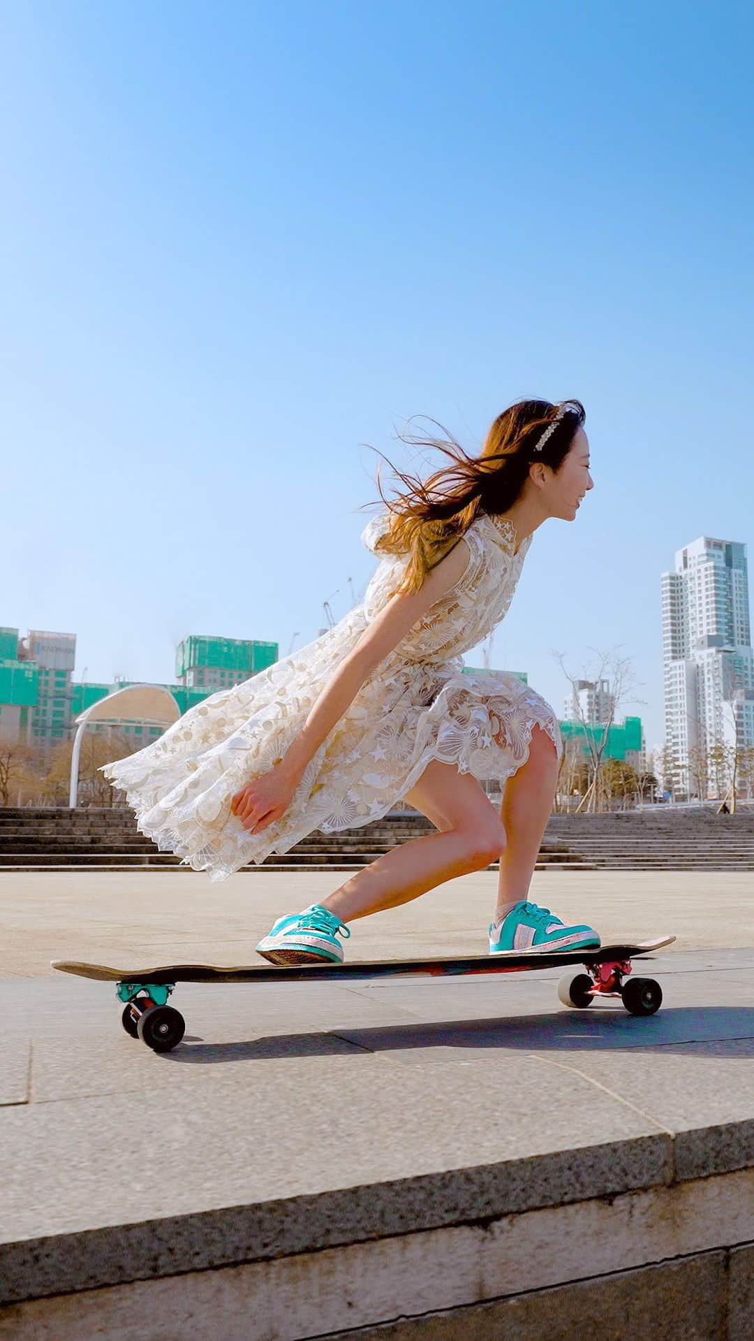 コ・ヒョジュのインスタグラム：「Longboarding in my CHARLES & KEITH sneakers💙 I wore summer clothes and filmed at Han River, and the weather was so cold! My face was smiling but my skin turned red and I couldn’t hide my goosebumps.🥶 But I feel good because it’s getting warm again!🌱  #CharlesKeithSS22 #ImwithCharlesKeith #CharlesKeithOfficial」