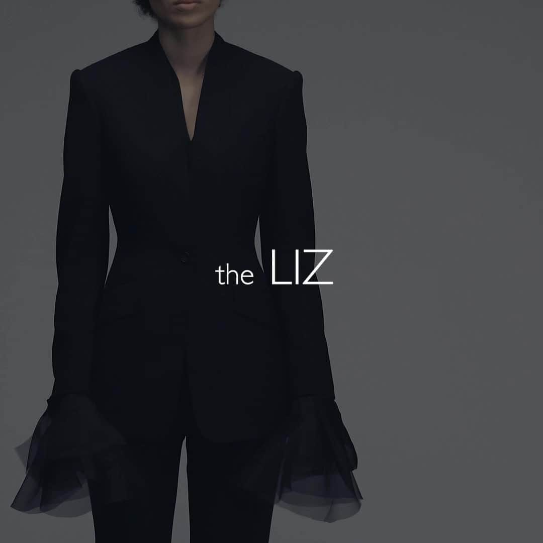 ハンツマンのインスタグラム：「Discover the Liz. Transition your look easily from day to night, with delicate organza cuffs that can be attached to the inside of the jacket sleeves, giving the jacket exaggerated movement and fluidity, for a playful, evening look. Part of the Huntswoman of Tomorrow collection. Visit LinkInBio for more!  @kitty_su @ethicalera Photographs by @nicktydeman Video by @Miriam.strong  #huntswomanoftomorrow #ladiesbespoke #womenstailoring #womenswear #luxuryfashion #huntsmansavilerow #ethicalera #sustainablefashion #sustainability #ethicalfashion」