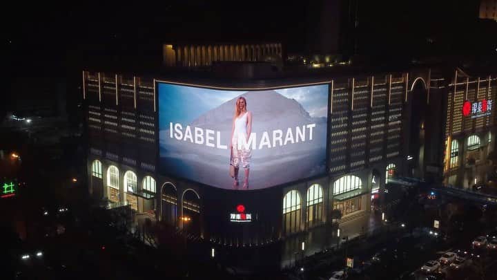 イザベルマランのインスタグラム：「Shining bright. Shot by @harleyweir, the #IsabelMarantSS22 campaign lights up a majestic building in Hangzhou, China.    Explore the full collection via link in bio.   #IsabelMarant」