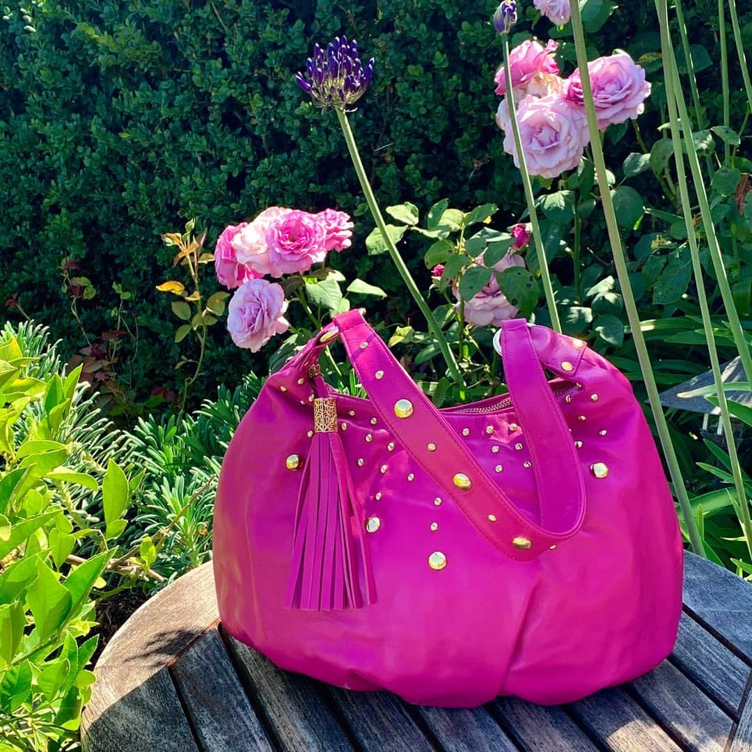 インガクリストファーのインスタグラム：「Brighten up your day with this cheerful pink Desdemona studded leather bag. Now on sale for $96 (Regularly $398). Choose from 3 bright colors: Pink, Orange or Chartreuse.  And take time to smell the roses.  ⠀⠀⠀⠀⠀⠀⠀⠀⠀ #summerfashion #colortrend #hotpink #fuchsia #colorfulfashion #colorfulstyle #ItsAColorfulWorld」