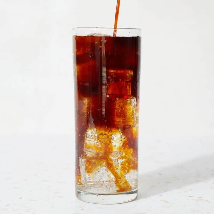 Blue Bottle Coffeeのインスタグラム：「Meet the NOLA Cola. We’re turning our New Orleans-Style Iced Coffee into a refreshing summer soda. With a touch of fragrant vanilla and a splash of sparkling water, our New Orleans-Style cold brew becomes a fizzy, creamy-tasting sunny day’s drink.  Don’t walk, run to your new favorite summer staple.」