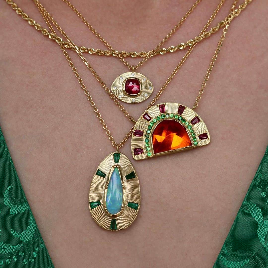 ブルックグレグソンのインスタグラム：「Bringing color and texture into Monday with hand engraved gold Talisman and Supernova necklaces! 💎🌈💕✨ #ruby #mexicanfireopal #emerald #tsavorite #uniquefinejewelry #brookegregson」