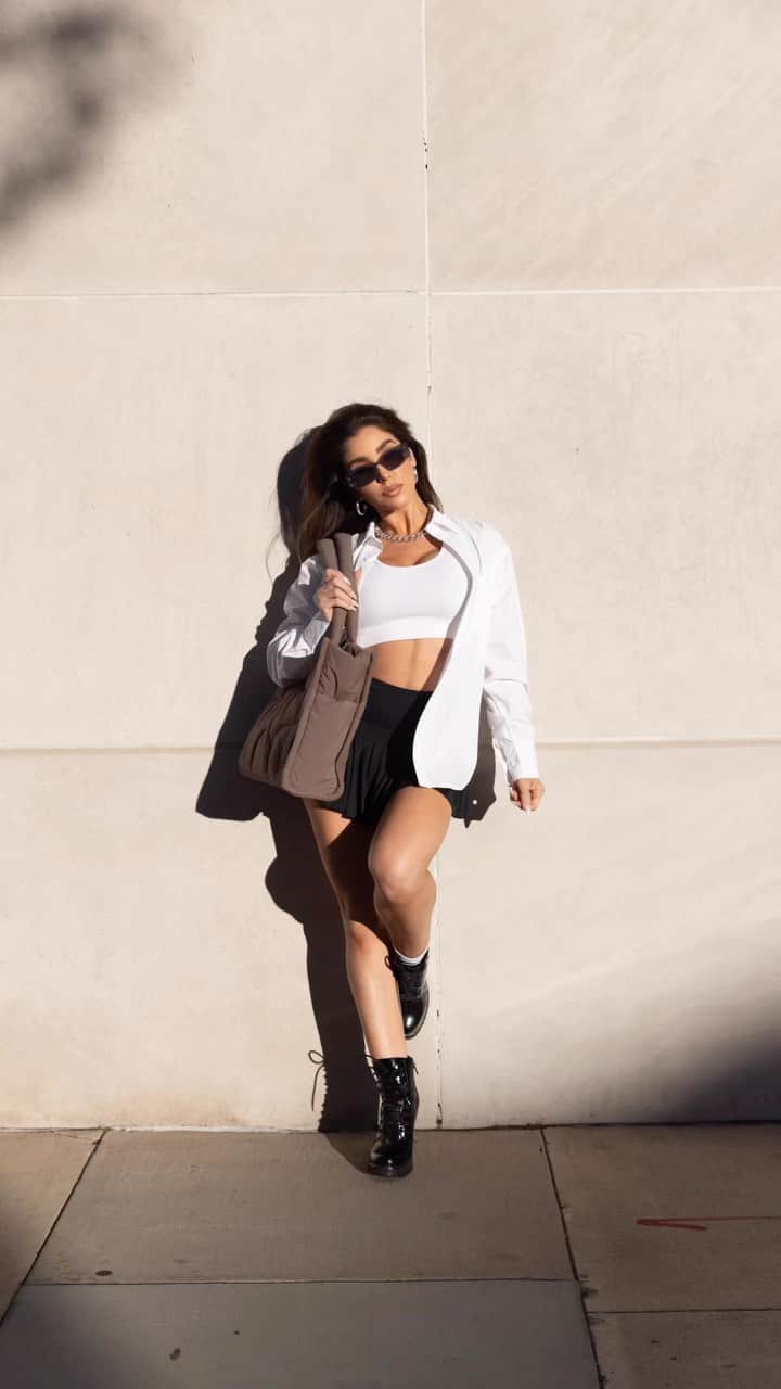 メリッサ・モリナロのインスタグラム：「What I'm Wearing  Skirt @movebymelissa Shades @dezi Tote in Clay: @thirtyyears  Ribbed White Crop: @thirtyyears  Dress Shirt: @thirtyyears  Leather Jacket: @zara Booties: @jefferycambell  Thigh High Boots: @louboutinworld」
