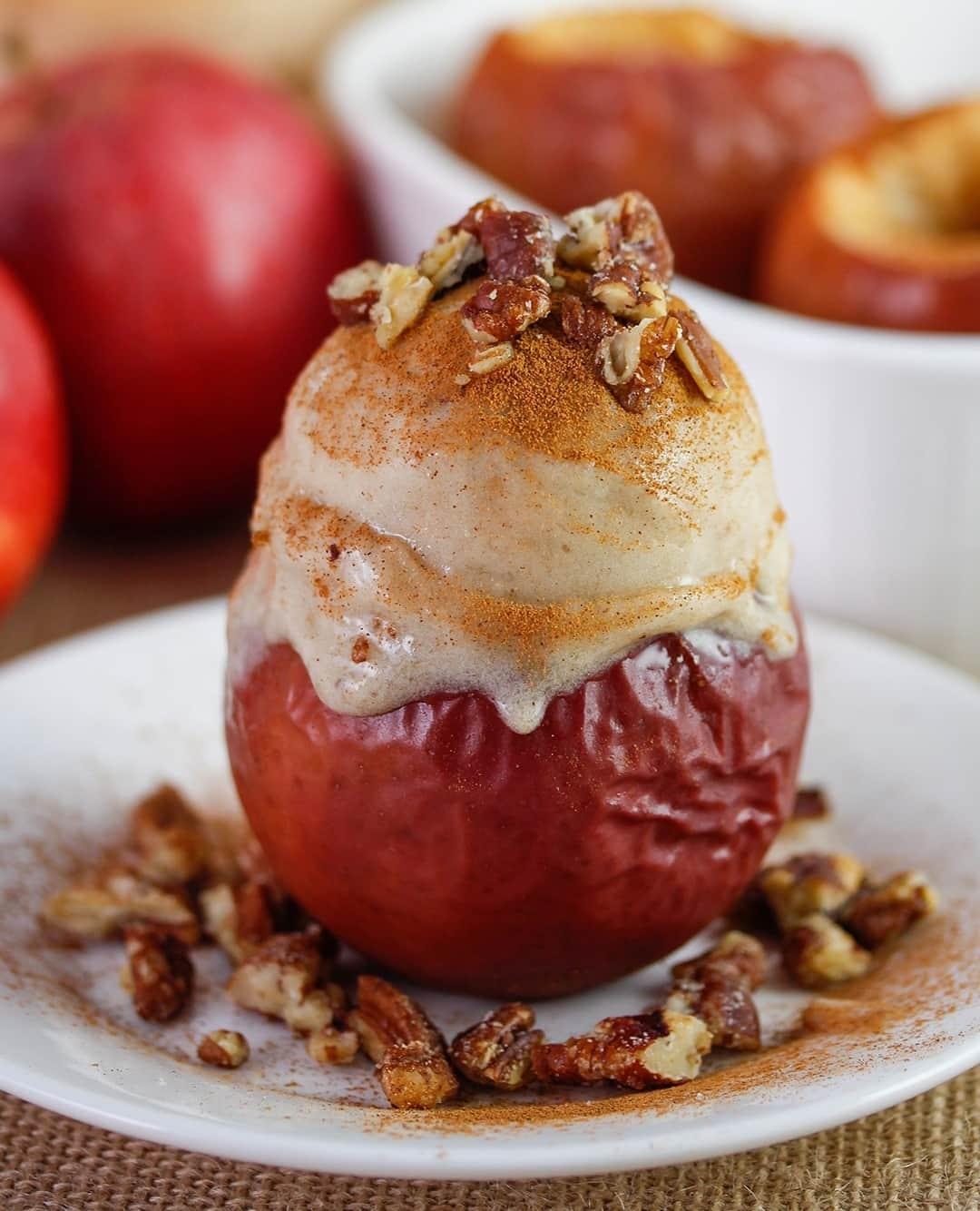 Yonanasさんのインスタグラム写真 - (YonanasInstagram)「This Baked Apple A La Yo has us like 🤩 Like and save for later!⁠ -⁠ Servings: 4⁠ ⁠ Ingredients:⁠ 1. 4 apples⁠ 2. Double batch of Cinnamon Yonanas⁠ 3. 1/2 teaspoon ground cinnamon⁠ 4. 1/4 cup crushed candied pecans⁠ 5. 1/2 cup water⁠ ⁠ Instructions:⁠ 1. Make baked apples: Preheat oven to 350¬∞ F. Wash apples well. Cut off the top and stem of apple. Using a spoon to hollow out and core the apples, leaving the base of the apple in-tact and leaving about 1/2" to 3/4" side walls. Place the apples in a baking dish standing up. Sprinkle cinnamon over apples. Add 1/2 cup of water to pan. Bake at 350 for 20 mins or until soft.⁠ 2. Allow apples to cool while making a double batch ofCinnamon Yonanas⁠ 3. Scoop Cinnamon Yonanas into the baked apples⁠ 4. Dust with cinnamon and top with crushed candied pecans.⁠ .⁠ .⁠ .⁠ .⁠ .⁠ ⁠ #icecream #yonanas #fruit #fruitdessert #dessert #dessertrecipe #fruittreat #healthy #healthyrecipe #healthydessert #healthydesserts #glutenfree #glutenfreedessert #vegan #veganrecipe #vegandessert #glutenfreerecipe #fall #thanksgiving #falldessert」11月22日 3時02分 - yonanas