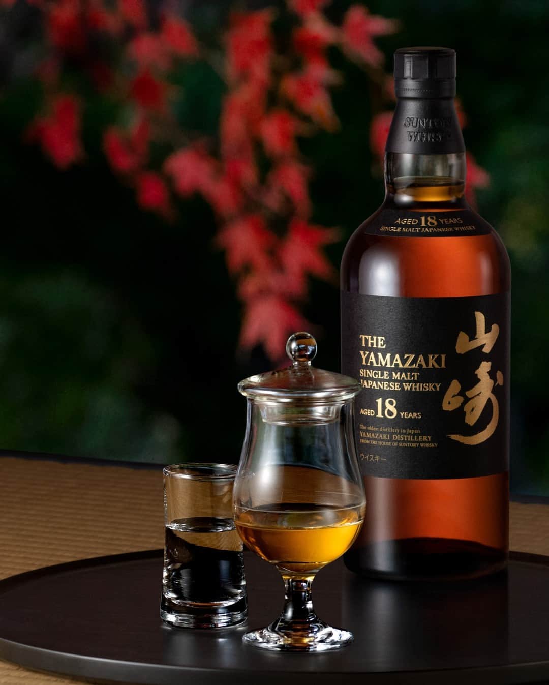 Suntory Whiskyのインスタグラム：「Bask in the fading light of golden hour amongst the red-gold hues of fall with the House of Suntory's Yamazaki 18. Enjoy it neat to savor its rich palate of blackberry, strawberry jam and dark chocolate.⁣ ⁣ #SuntoryTime #HouseofSuntory #SuntoryWhisky #JapaneseWhisky #Whisky #Yamazaki #Whiskygram #Drinkstagram」