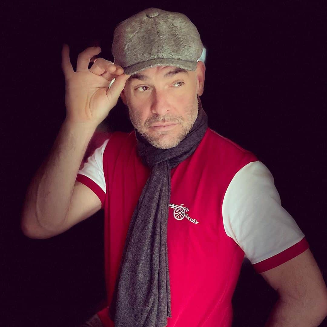 のインスタグラム：「Modeling my much appreciated Christmas gifts: Retro Arsenal shirt, Marks&Sparks mottled cap, and nice soft grey scarf. Happy Camper. Hope you’re all having a lovely day X」