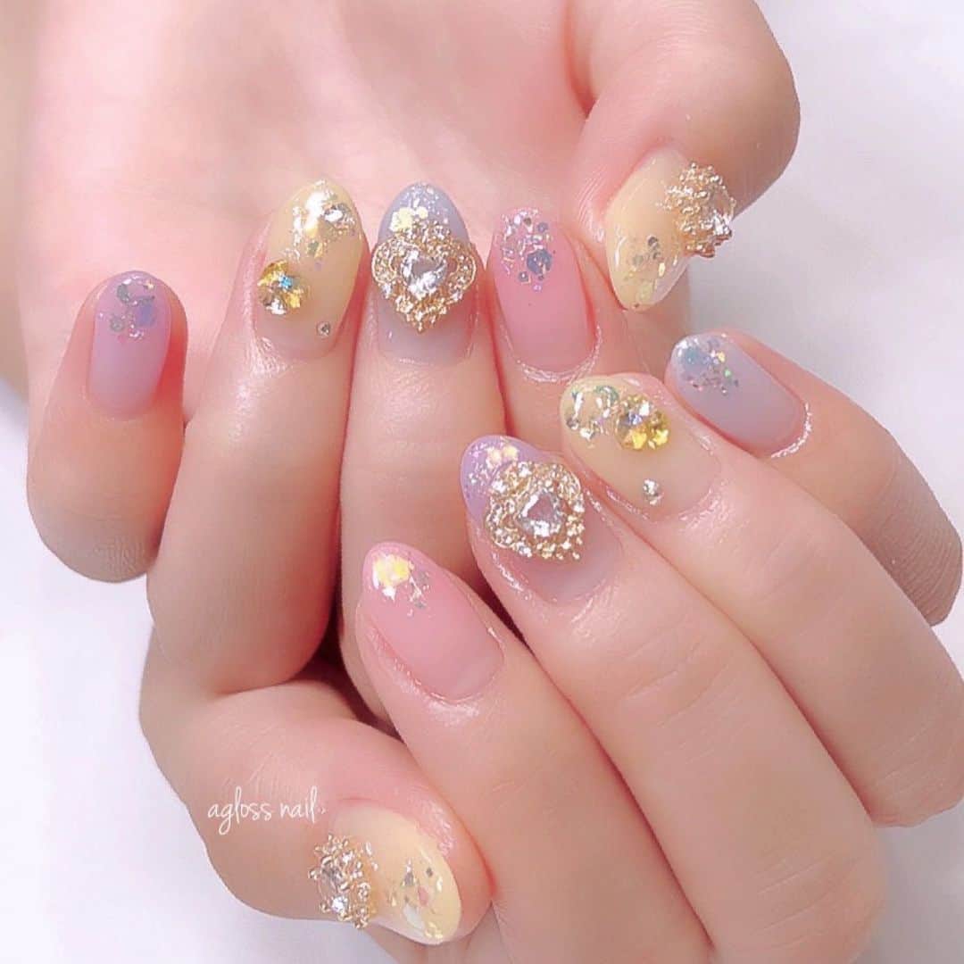 のインスタグラム：「💖💙💛💜 @agloss_nail  デパプリ感謝祭ネイル💐  ハートのパーツが プリキュア❣️って感じで とてもお気に入りでした♡  親指のお花パーツはキラキラ✨ ヤムヤムっぽくてかわいいっ🍥🌼💛  キャラクター達が側に居てくれるような気がして とても心強かったです☺️  素敵なネイルをありがとうございました💛💛💛」