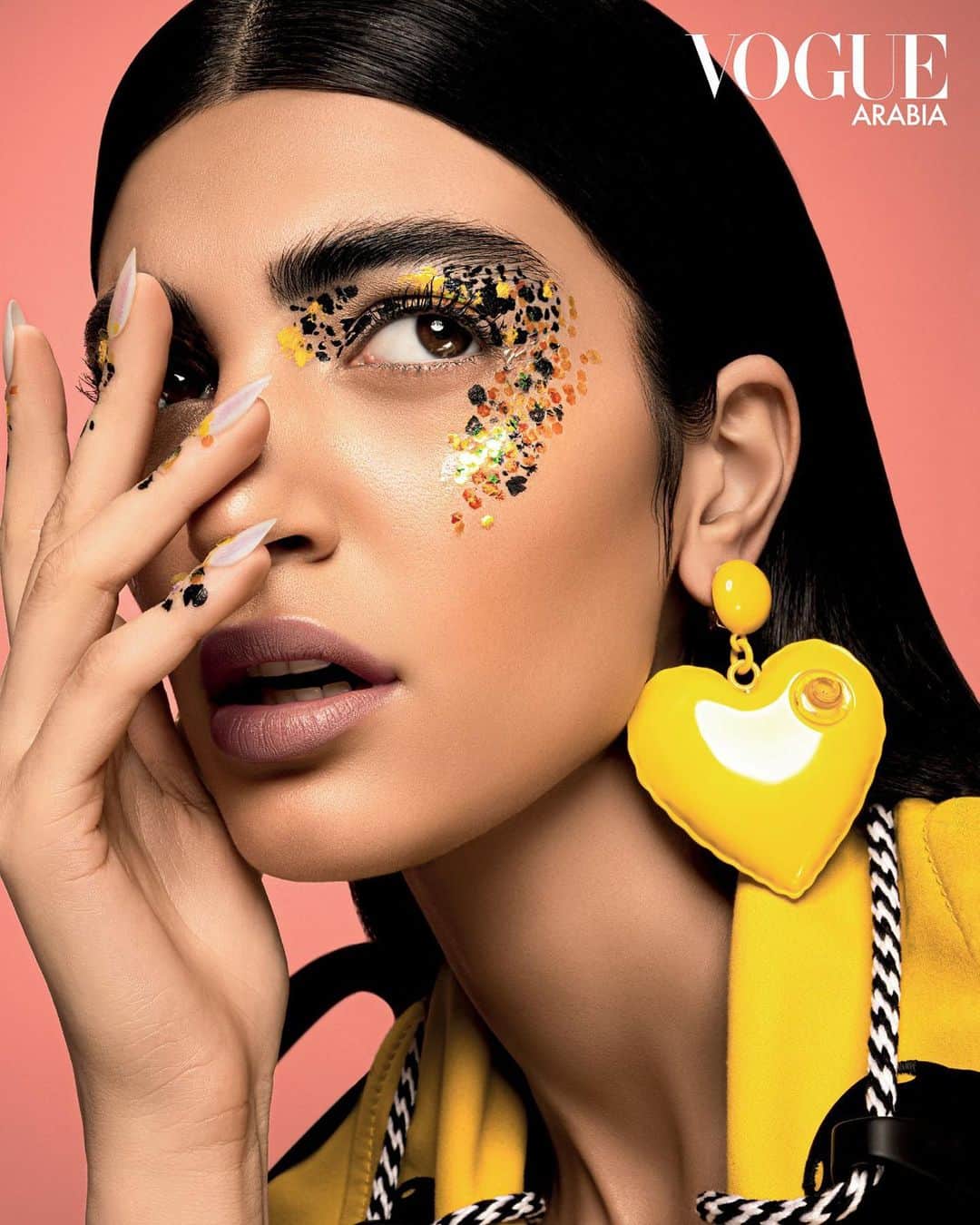 Moschinoのインスタグラム：「When your face card never declines. 💳   The stunning model @soulinomar wears the #MoschinoSS23 inflatable heart earrings and nautical jacket for @voguearabia. Photography: @alainegues Stylist: @pablo_patane   #Moschino #MoschinoEditorials」