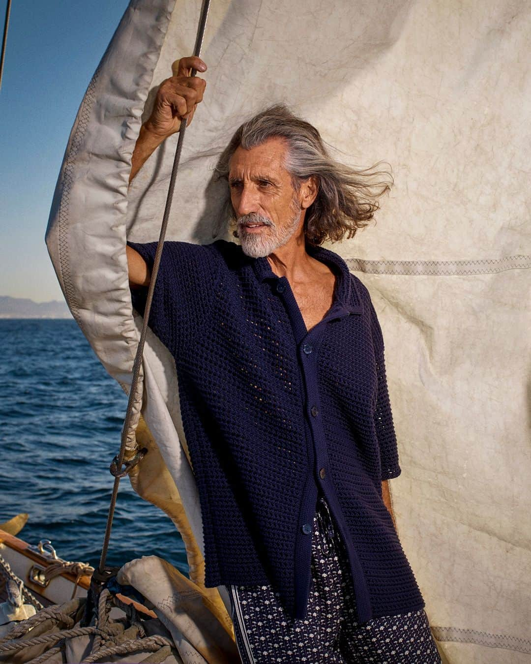 オールバーブラウンのインスタグラム：「A stitch in time.  Our organic cotton THOMAS shirt in Night Iris is care full.  Boasting a 5-gauge crochet knit that creates the ultimate luxe texture. This effortless style can quickly transform into a cardigan if left unbuttoned. Sea it all.  Discover OB Spring '23 at orlebarbrown.com  #HolidayBetter #OBSpring23 #OrlebarBrown」