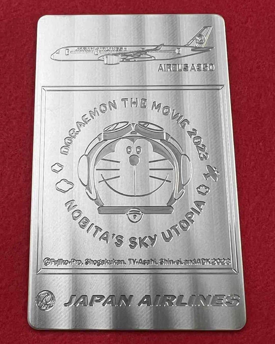 ドラえもんさんのインスタグラム写真 - (ドラえもんInstagram)「JAL 整備士が作る記念オリジナルチタンプレート『映画ドラえもん のび太と空の理想郷（ユートピア）』特別デザイン300枚限定発売！航空機のエンジンなどに使用されている材料と同素材のチタン合金製です。   「ドラえもんチャンネル」へはプロフィール欄（ @dorachan_official ）から♪  #ドラえもん  #doraemon #ドラえもんチャンネル #JAL  #JAL整備士  #オリジナルチタンプレート  #映画ドラえもん #映画ドラえもんのび太と空の理想郷  #のび太と空の理想郷」4月12日 14時00分 - dorachan_official
