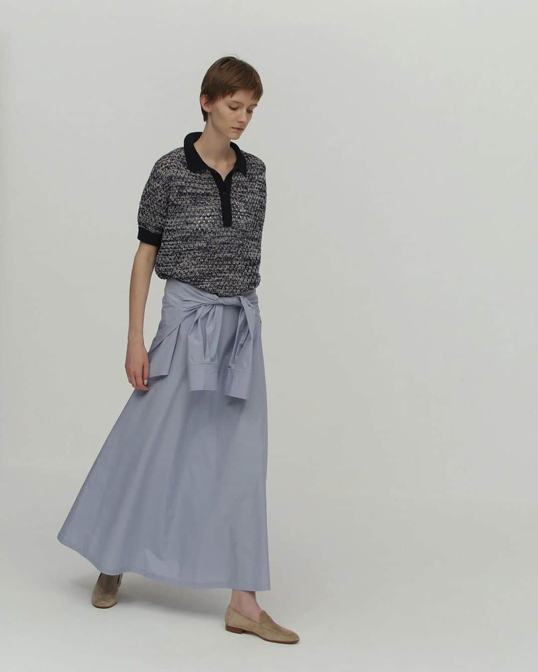 UNDECORATED MANのインスタグラム：「Cotton Wrapped Skirt  50番手コットンタイプライターを使用したハリ感のある素材を使用しています。環境に配慮し水をなるべく少量に抑え、熱風で生地を揉み込む特殊な加工を施し、ラフな表情に仕上げました。シャツを巻いたようなユニークなディテールはヒップラインをカバーする機能性も加味しています。 たっぷりとボリュームを使ったシルエットが美しいマキシ丈のラップスカートです。 #undecorated #アンデコレイテッド」