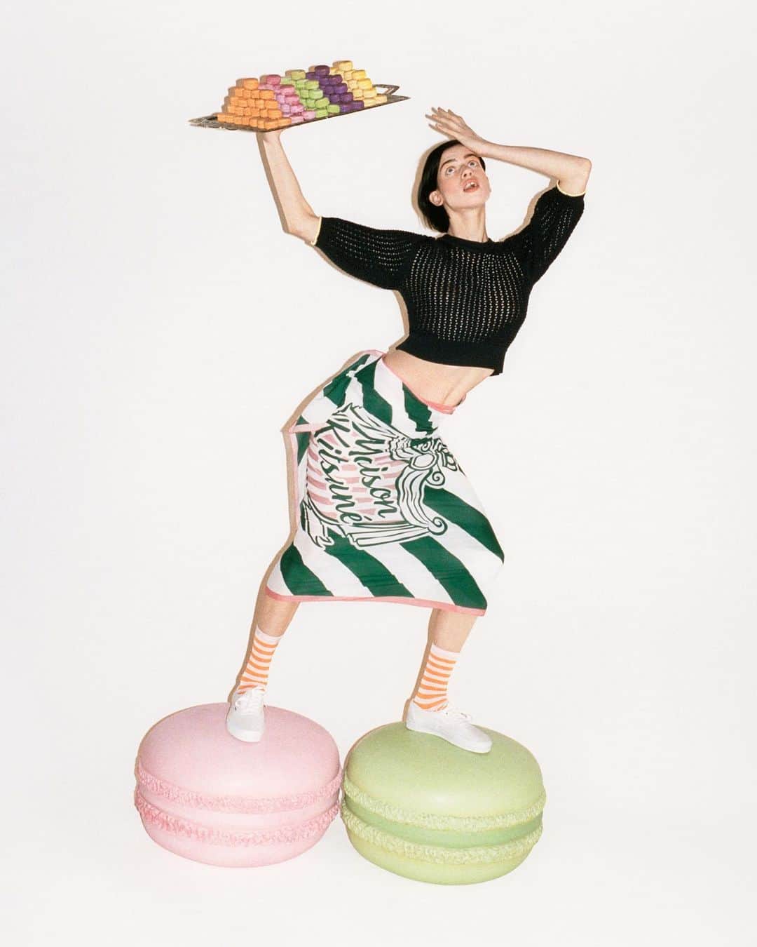 オランピアルタンのインスタグラム：「Lily!!! ♥️ Stepping on some rather large macaroons for “Sweet Souvenirs”, a collection by @thehotelolympia and @maisonkitsune in stores now! 🏩🗼🥖🦊  📸 Photo @antongottlob  📋 Art Direction @reidjamie  💃🏻 Styling @emimikareh  👯‍♀️ Model @lilymcmenamy  💇🏻‍♀️ Hair @blakejhenderson  💄 Make-up @laurenfreynolds  💅🏼 Nails @saffrongoddard  🛠️ Set design @lydiaaachan  👩‍❤️‍👩 Casting @goodcatch_  📲 Production @faragoprojects  🦊@zehouanekarim @gildaskitsune @masayakitsune  #MaisonKitsune #sweetsouvenirs #thehotelolympia」