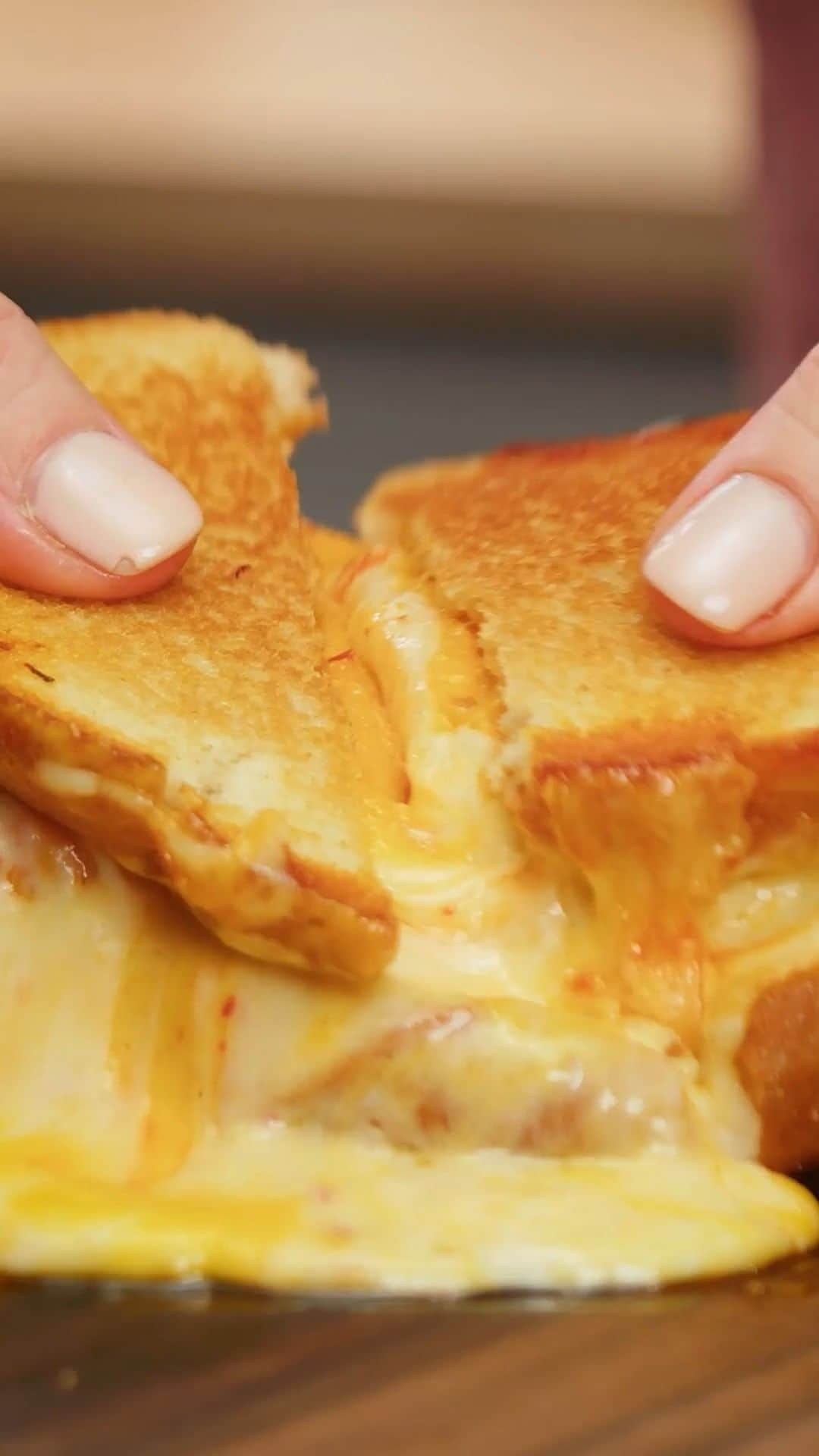 Lee Kum Kee USA（李錦記）のインスタグラム：「Call us cheese lovers 'cause we definitely crushed this 8 Cheese Loaded Kimchi Grilled Cheese Sandwich! 🧀🥪  Recreate this cheesy recipe with Lee Kum Kee Panda Brand Cooking Soy Sauce, Sriracha Mayo, Minced Garlic, and Chili Garlic Sauce.   #leekumkee #leekumkeeusa #grilledcheese #grilledcheeserecipe #grilledcheesesandwich #kimchi #soysauce #srirachamayo #chiligarlic #garlic」