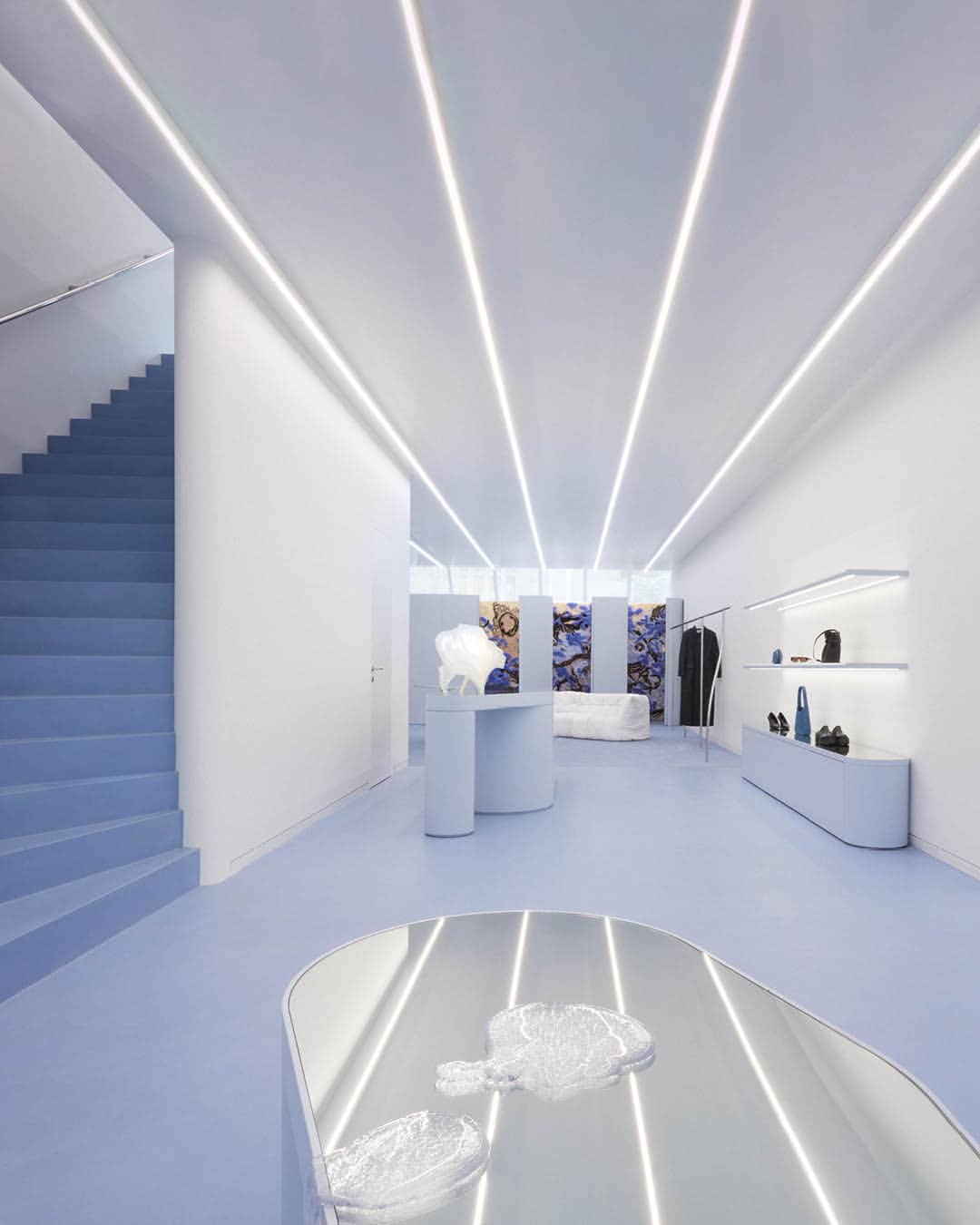 フィリッパコーのインスタグラム：「Step inside the new Filippa K store in Amsterdam, the latest chapter in the house’s ongoing transformation  The location explores the brand's icy blue hue, where elements of refinement are balanced with rawness. Nature informs the design choices as clothing rails rendered in chrome feature subtle distortions in their form, as if they were reflections in a pool of water.   We hope to see you at P.C. Hooftstraat 125, Amsterdam.  A collaboration with @profan.img Photographed by @studioamosfricke」