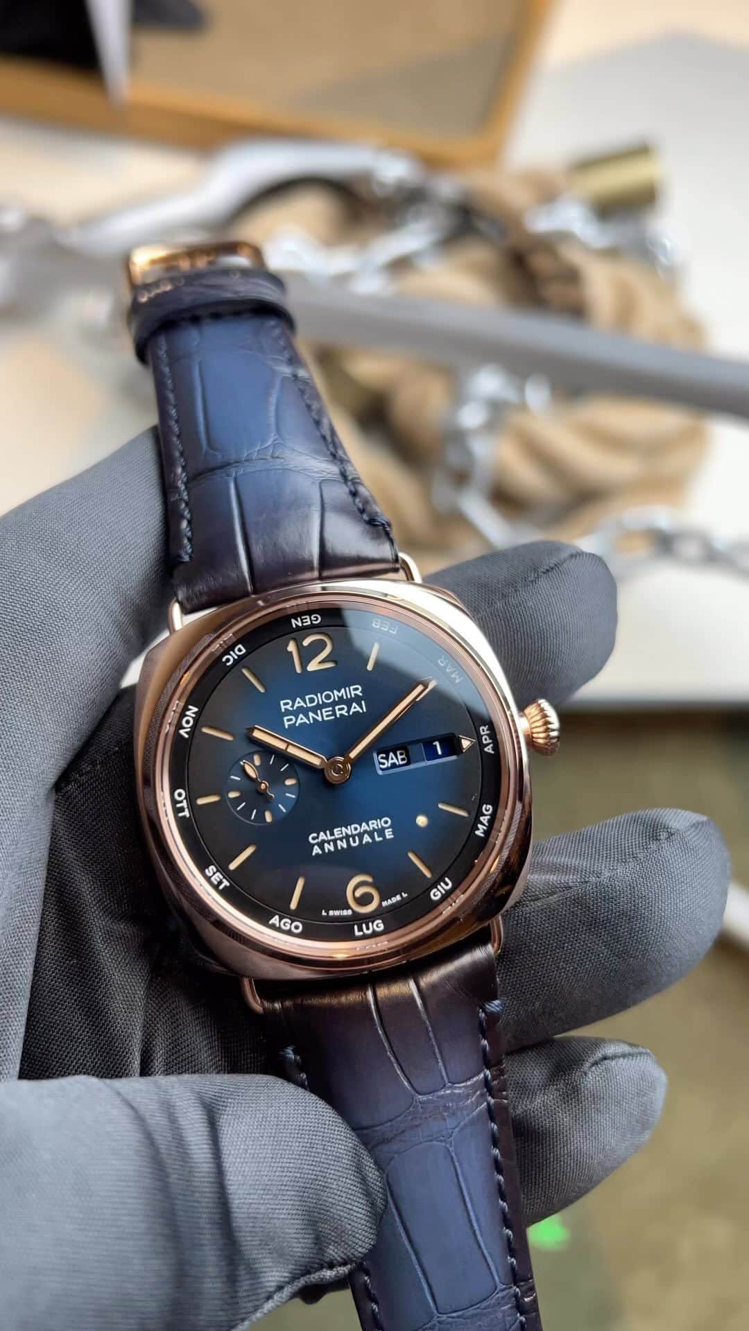 パネライのインスタグラム：「Time to get a little complicated.  This is the #Panerai PAM1363 Goldtech Annual Calendar Radiomir with blue sunburst dial.   Despite the annual calendar being a very intricate complication, Panerai created this beauty which features the seconds, minutes, hours, days, and now each moth of the year.  The current month is displayed on an external moving disc furthest from the center which is indicated by a fixed arrow at the 3 o’clock position to the right of the date.  the 31st is done automatically by the mechanism. This setting only needs to be adjusted 1 time a year at the end of February. To make setting this piece easier a corrector on the left side of the case allows it click by click.  Available for $39,200」