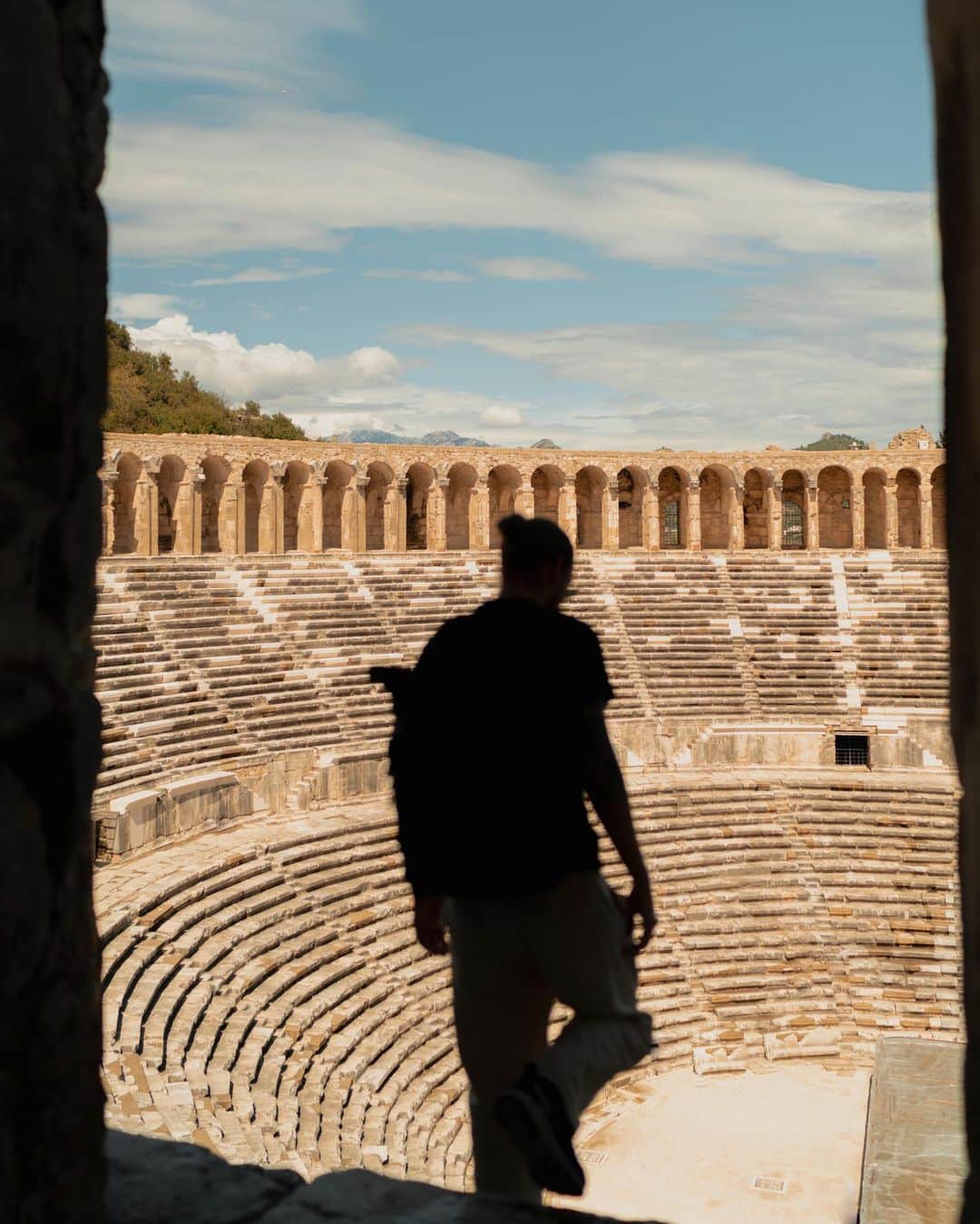 Putri Anindyaのインスタグラム：「Walking in History //  Visiting Aspendos Theatre definitely one of the highlight in my life. Knowing how important the history of this place made me fall in love at every inch of this place. Turkey government took care of this place very well and it became one of the most preserved ancient roman theatre in the world. Be sure to visit this grand landmark when you visit Antalya.   also thanks to @mary_quincy for taking some snaps of me here ✨  #goantalya #goturkiye #turkey #antalya」