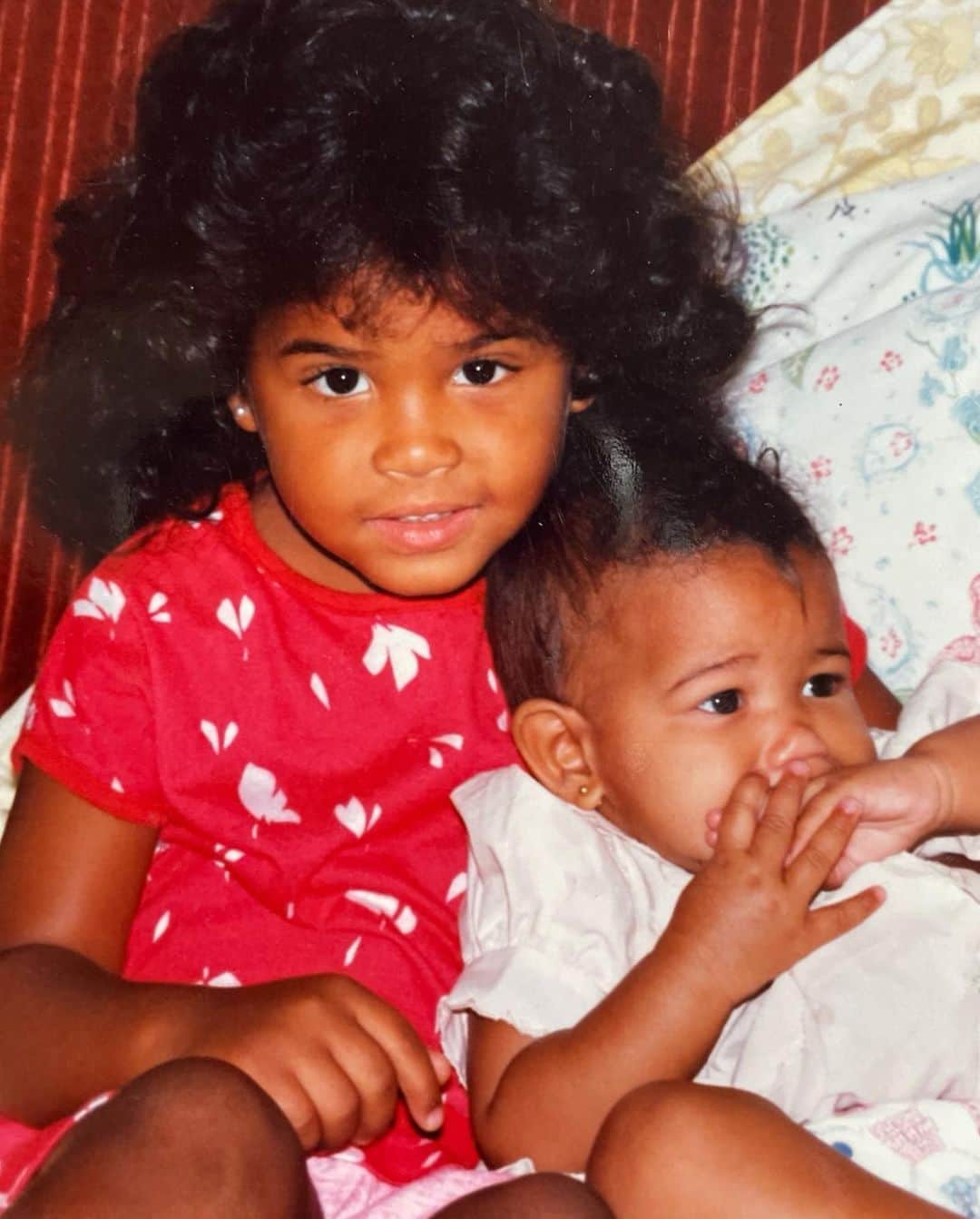 クリスティーナ・ミリアンのインスタグラム：「Funtastic files of my colorful childhood 😋  1. A fluffy haired me with my sister Danielle.. aka Bubu Bear.   2. My grandma made me this dress so on turn my Mom took me to JC Penny to take a pic as gratitude for making the dress. You can’t see my mustache but it’s there.   3. My Cindy Lauper era   4. You weren’t cool until you had a birthday party at McDonalds   5. Roller girl at Andrews Airforce base   6. At the air show. Andrews Airforce Base. In front of our house had the best view.  7. Walk the catwalk at John Casablanca. I thought I was living the dream!   8. Waldorf MD w/ my sisters in front of our townhouse at Oakwood Neighborhood. We always matched. In Jessica McClintoc. Mom’s gardens were always epic. 1st day of school.   9. Once again another great outfit Mom dressed me in. I miss this hairstyle. How did my hair get so curly though?!   10. Always goofy. Need to go back to this. Boxing was a definite passion of mine.」
