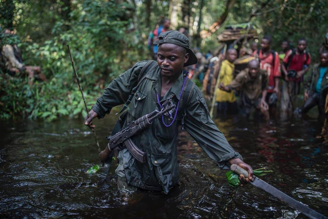 thephotosocietyのインスタグラム：「Photo by @thomas.nicolon // Hiking through Salonga National Park’s flooded areas was a lot of fun. Antoine Bolito is such a great guy and an awesome park ranger. Here he is leading the group. // Follow me @thomas.nicolon for more stories from tropical rainforests.」