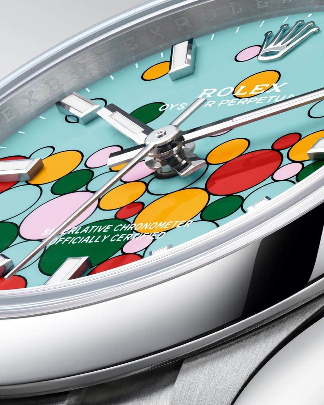 rolexさんのインスタグラム写真 - (rolexInstagram)「The new dial motif of the Oyster Perpetual is composed of differently sized bubbles fringed with black and encapsulates five vivid colours: candy pink, turquoise blue, yellow, coral red and green. This effervescent, euphoric design is the product of masterful technique. The dial decoration is carried out in strictly controlled conditions and requires the utmost precision at every stage to create a marvel of colour. #Rolex #OysterPerpetual #WatchesandWonders2023」4月4日 0時00分 - rolex