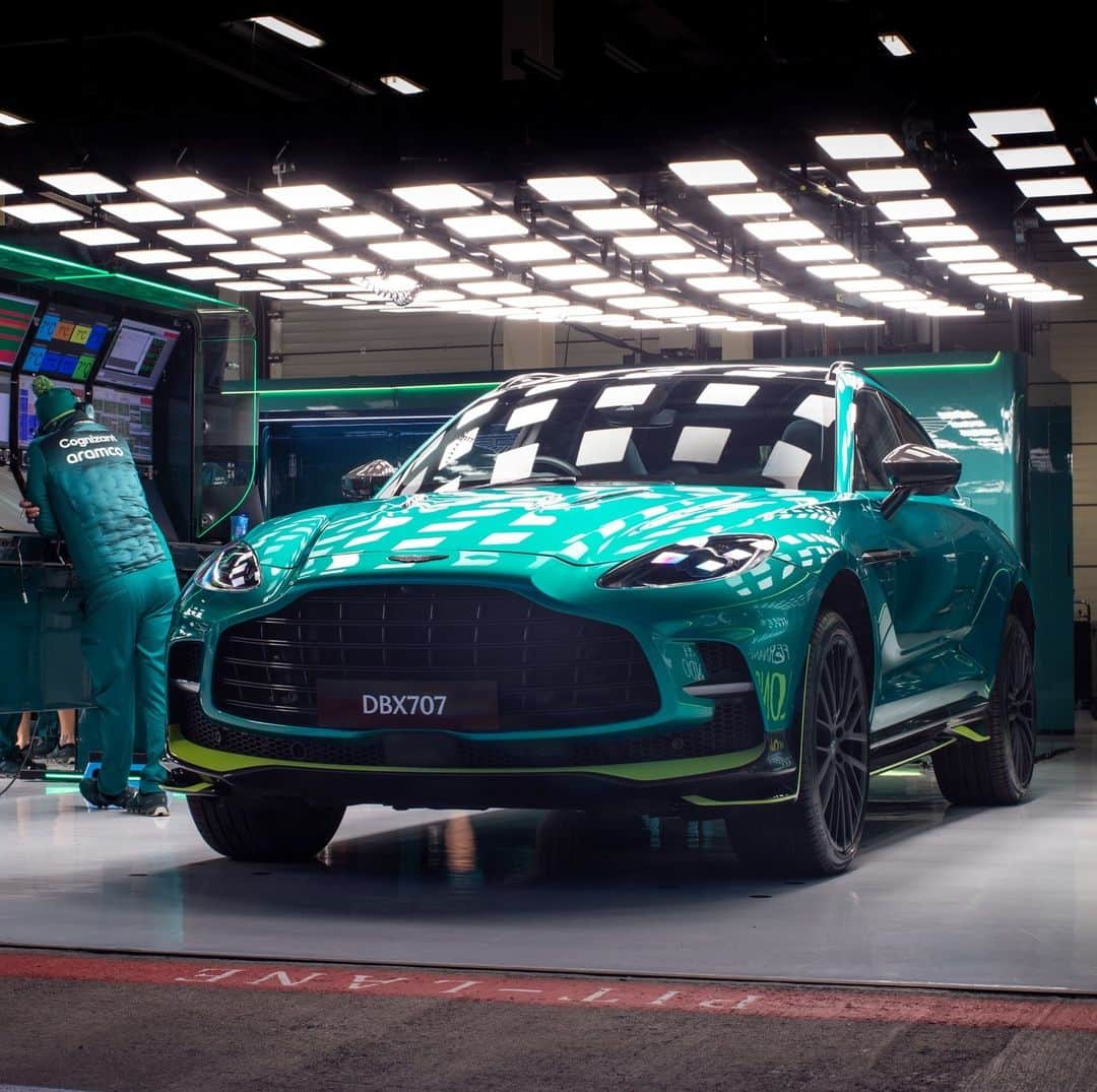 アストンマーチンのインスタグラム：「Power. Heritage.   The Aston Martin DBX707. As at home on the road, as it is in the pit garages of Silverstone.  #AstonMartin #DBX707 #POWERDRIVEN」