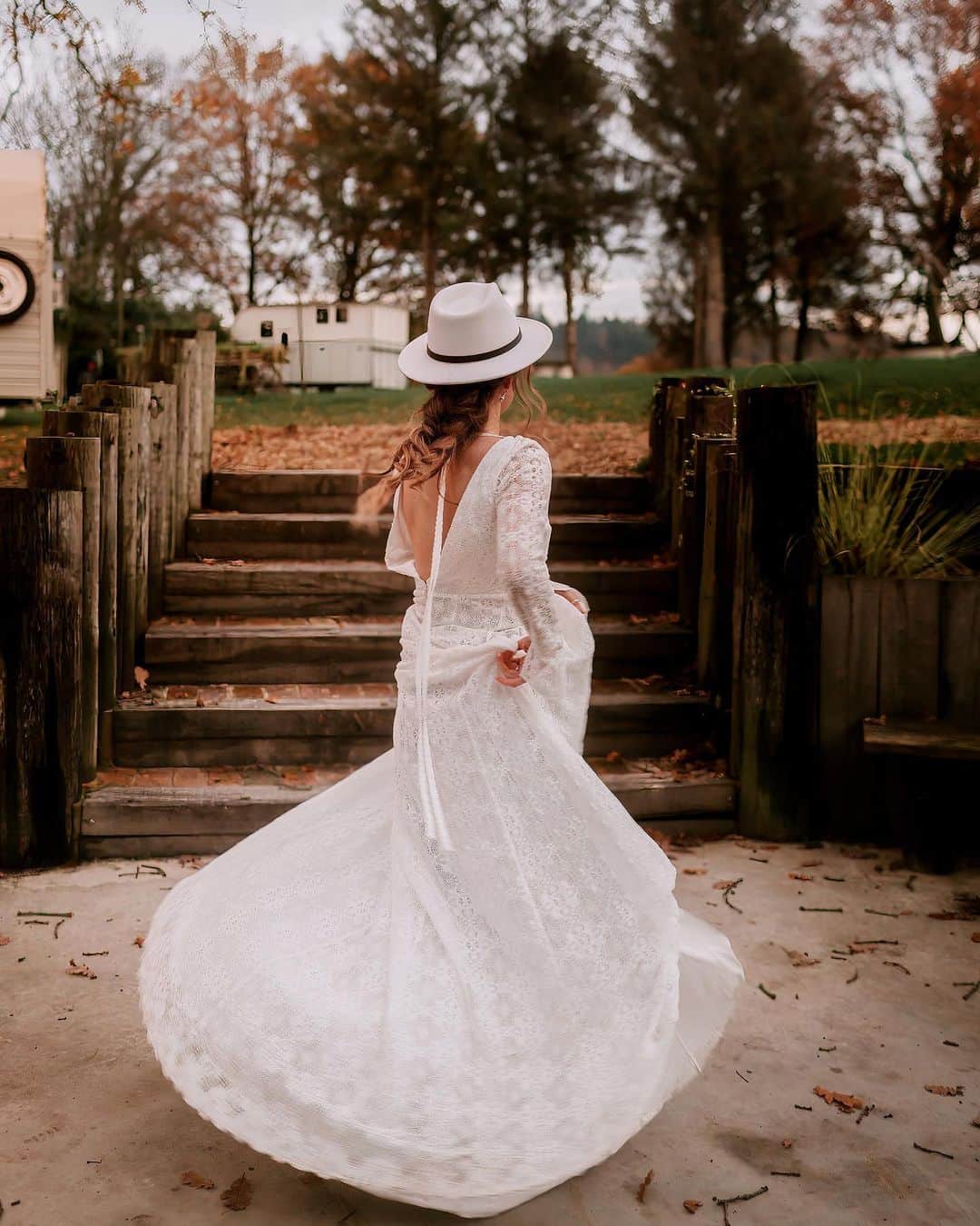 ミナのインスタグラム：「Throwback to this stunning winter themed photoshoot. I absolutely love how the boho, luxe, and wintery/Christmas themes all come together to create the perfect wedding setting and how our Harley and Noemie dresses complemented the rustic decor.  Read all about it on @rockmywedding   Venue @oaktreebarnweddings Wedding Planner and Styling @twobecomeoneweddingplanner Photographer @sonder.lust.photography Videographer @chrisjeromejames Props and Styling @the_prop_library Florist @thelittleflowershopltd Wedding Dresses @indiebride.london Cowboy boots & hat @melbelle.co.uk Cake Designer @allshapescake Wedding Stationery @heartedesigns Hair and Makeup Stylist @idomakeupandhair_ Celebrant @trueblueceremonies Bride Model @ioanaa_nagy Groom Model @_basil_dsouza_ Neon Sign @bayweddingprops」