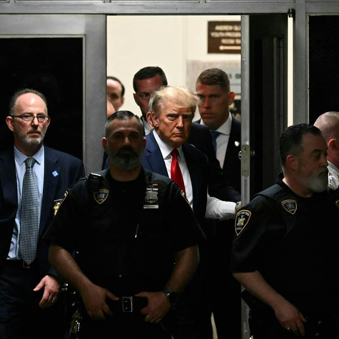 TIME Magazineのインスタグラム：「Former President Donald Trump has been charged with 34 felony counts of falsifying business records and pleaded not guilty to all charges, according to media reports.   He surrendered to prosecutors at a lower Manhattan court this afternoon and was arrested for his alleged role in disguising hush money payments in corporate records before the 2016 election.  Follow the link in our bio for the latest updates.   Photographs by Ed Jones (@edjonesafp)—@afpphoto/@gettyimages; @drewangerer—Getty Images; Angela Weiss (@angelaweissphoto)—AFP/Getty Images; @ismailferdous—Bloomberg/Getty Images」