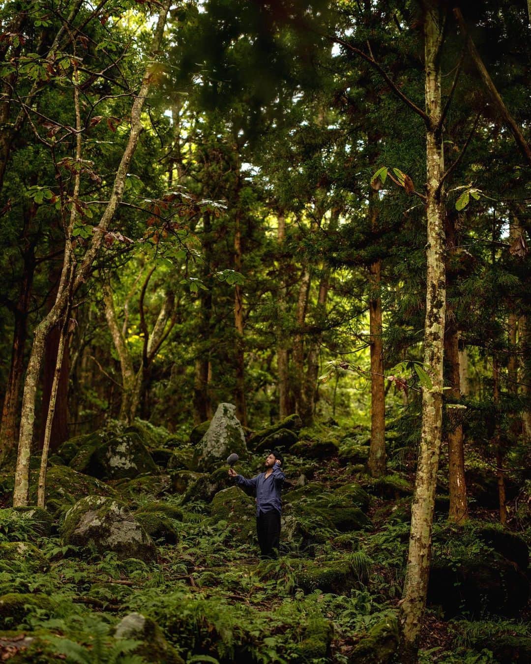Kinfolk Magazineのインスタグラム：「Less than a week until the launch of Kinfolk Wilderness, our new travel book! Order your copy now from Kinfolk.com and it will ship immediately. Pictured: Sound artist Yosi Horikawa in a folkloric forest in Iwate Prefecture, Japan. Making field recordings of nature is one of many unusual travel ideas featured in the book, which also includes star gazing and truffle hunting itineraries. ✨🐽 Order your copy at Kinfolk.com/shop.  (Photos: @renee_kemps)」