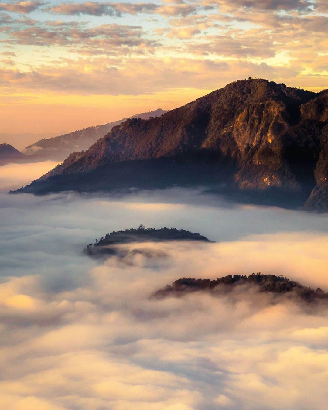 Canon Asiaのインスタグラム：「Is this what nirvana looks like? 😇 🕊☁️⁣ ⁣ @cj_karki photographed this slice of heaven while on a trip to Syangja, Nepal. 😳 No kidding – it's like the tales of mystical faraway lands brought to life! The sheer volume and density of the rolling fog only bolster the ethereal vibes of this picture, making the landscape appear as if it were sandwiched between two cloud layers. ⁣ -⁣ 📷 Image by @cj_karki on Canon EOS 5D Mark IV | EF50mm f/1.8 STM | 50mm | f/8 | ISO 400 | 1/800s⁣ ⁣ Got a stunning shot you're proud of? Tag them with #canonasia or submit them on My Canon Story, link in bio!⁣ -⁣ #TeamCanon #CanonAsia #CanonPhotography #CanonPhoto #CanonImages #CanonLens #CanonColourScience #PhotoOfTheDay #IAmCanon #ThePhotoHour #TravelPhotography #LandscapePhotography」