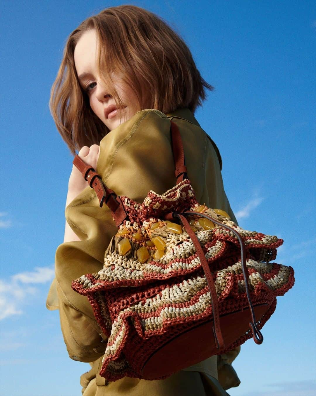 アルベルタフェレッティのインスタグラム：「Float through life with whimsy, carrying the new Spring Summer 2023 raffia bucket bag reimagined with an artisanal crochet motif and enriched by multicolor beads.   #AlbertaFerretti #Wanderlust #SS23」