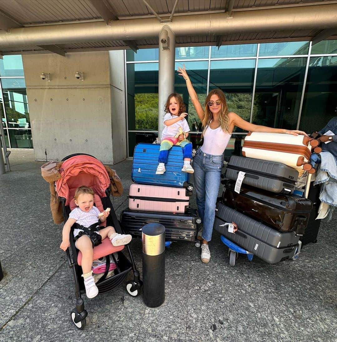 ミリー・マッキントッシュさんのインスタグラム写真 - (ミリー・マッキントッシュInstagram)「After our recent trip to Cyprus my verdict is that travelling with two children under 3 is not for the faint hearted…no matter how prepared you are, you will never be prepared enough!!   We took a yo-yo pushchair which can go in the over head luggage and I used a sling with Aurelia. I filled a hand luggage suitcase with different bags that could come in useful with changes of clothes, nappy changing bag, ALL of the snacks and entertainment, I packed sticker books for Sienna and a busy board book for Aurelia. The girls both have the same iPad and case with their favourite shows and games downloaded to avoid jealousy.   This all sounds very organised but the reality was a tornado of mess and tantrums!!  The mess was horrific, I honestly don’t know how two such small people can create so much mayhem  in such a small space! I felt so embarrassed when we got off the flight, apologies if you were sat near us!  Sienna had her own seat and was on the whole a lot easier to manage than Aurelia, apart from a few small tantrums she mainly stayed in her seat, ate snacks and watched her iPad. Aurelia was the opposite…. she wouldn’t stay still, wasn’t entertained by anything for long and just wanted to climb everything and on everyone. Aurelia napped for about 10 minutes in the sling, Sienna started shrieking and woke her up 🤦🏼‍♀️   There was a two hours time difference (ahead of the UK) but we kept the girls on UK time which I haven’t tried before, it meant we could eat meals all together at 9, 2 and 7pm and they had their lunch time nap at 3-5 went to bed at 9pm which is similar to their nap and bedtime routine back home.   I co slept with Aurelia for the week which was amazing for the bonding moments and closeness but not ideal for my sleep! She was meant to be in a cot in my room but as soon as she knew I was there she would scream until i brought her into my bed. We had a lovely time away and the stress of travelling was massively outweighed by the amazing memories we made. Our next trip is in June please send me your recommendations, what worked for you? What should I travel with? Does it get easier?! 🙏🏼😂」5月4日 21時08分 - milliemackintosh