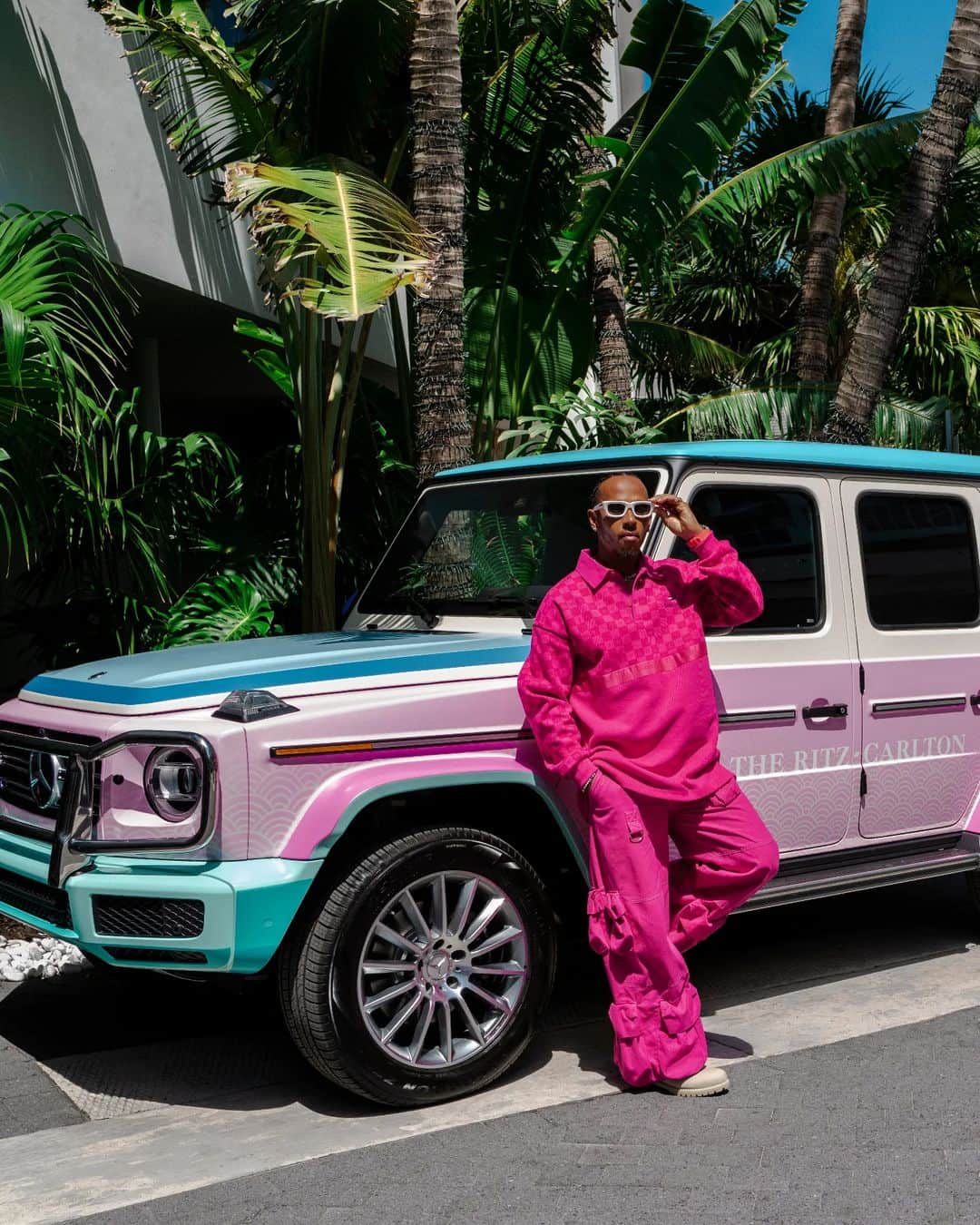 リッツ・カールトンのインスタグラム：「A stylish start to our Grand Prix weekend with @mercedesamgf1: Miami neon and art deco pastels inspire the legend @lewishamilton's pre-race look and our custom-wrapped @mercedesamg G-Class wagons, designed by Artist Partner @louisnicolasdarbon for eye-catching arrivals at @ritzcarltonsouthbeach.」