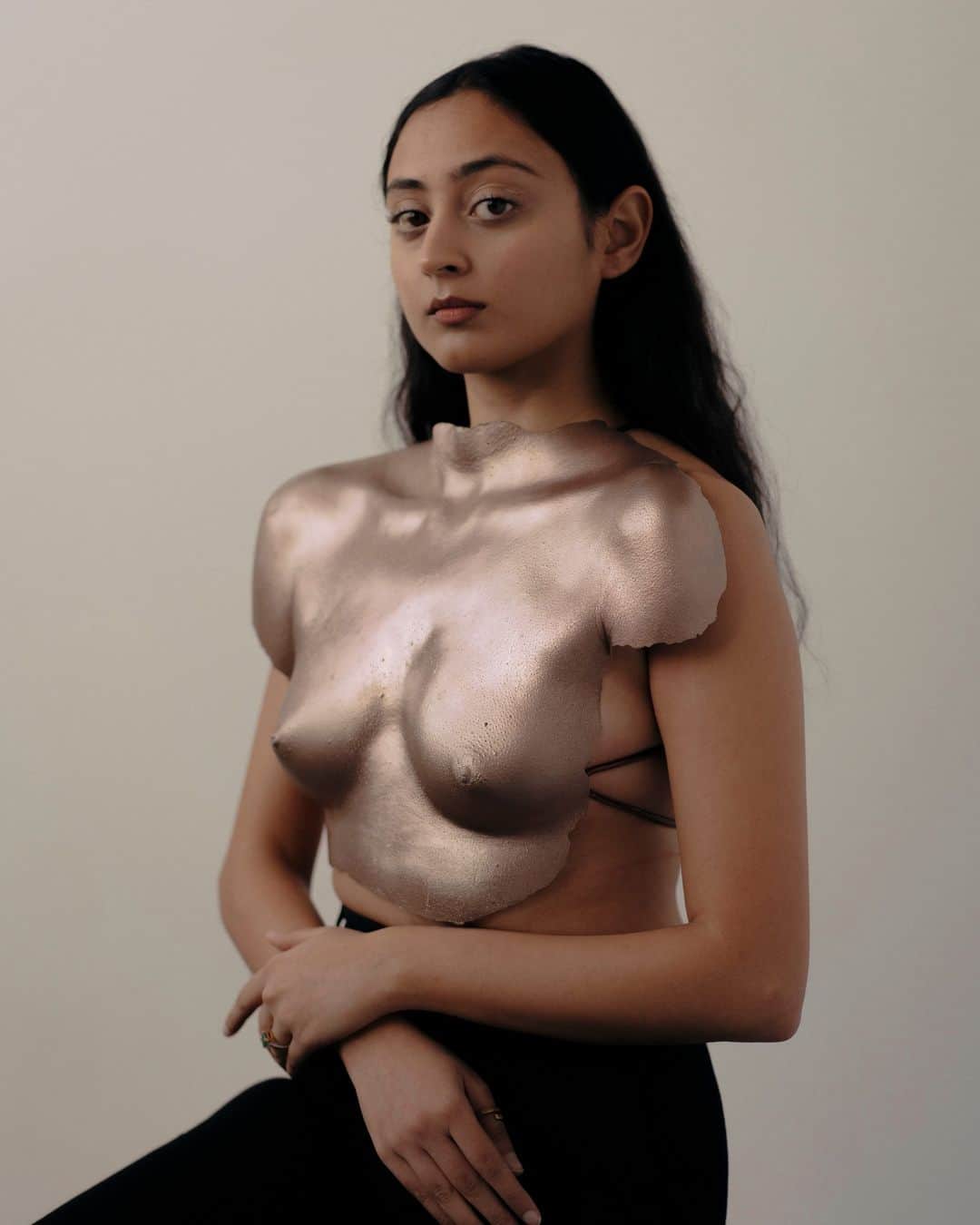 New York Times Fashionのインスタグラム：「Misha Japanwala, a visual artist, spent several months last year making body castings of local women and LGBTQ people in Karachi, Pakistan, where she grew up. The nipples she plaster cast from the bodies of 70 anonymized Pakistani people are part of Japanwala’s new collection, “Beghairati Ki Nishaani: Traces of Shamelessness,” showing at Hannah Traore Gallery in Manhattan through July 30.   Her work aims to be a historical record of a population governed by the laws of shame.  In a country where violence against women, including “honor killings,” is rampant, attending an Aurat (Women’s) March, a rally for women’s rights, has led to threats of murder and rape.  “When so much of our existence has been subject to a campaign of disappearance, this collection is a present day, physical reminder that our lives and our stories are part of the fabric of our people, and will continue to be so even hundreds of years from now,” Japanwala said in an interview with The New York Times.  As her work gained visibility, the comments under pictures of her work on Instagram were littered with strangers calling her shameless and obscene.As a result, Japanwala developed an obsession with the concept of shame, transforming shamelessness into an area of study. There are three parts to the collection: the core, a series of body castings of Pakistani artists and painters who embrace shamelessness in the images they create.  See more of @mishajapanwala’s work at the link in bio. Photo by @zay.ira」