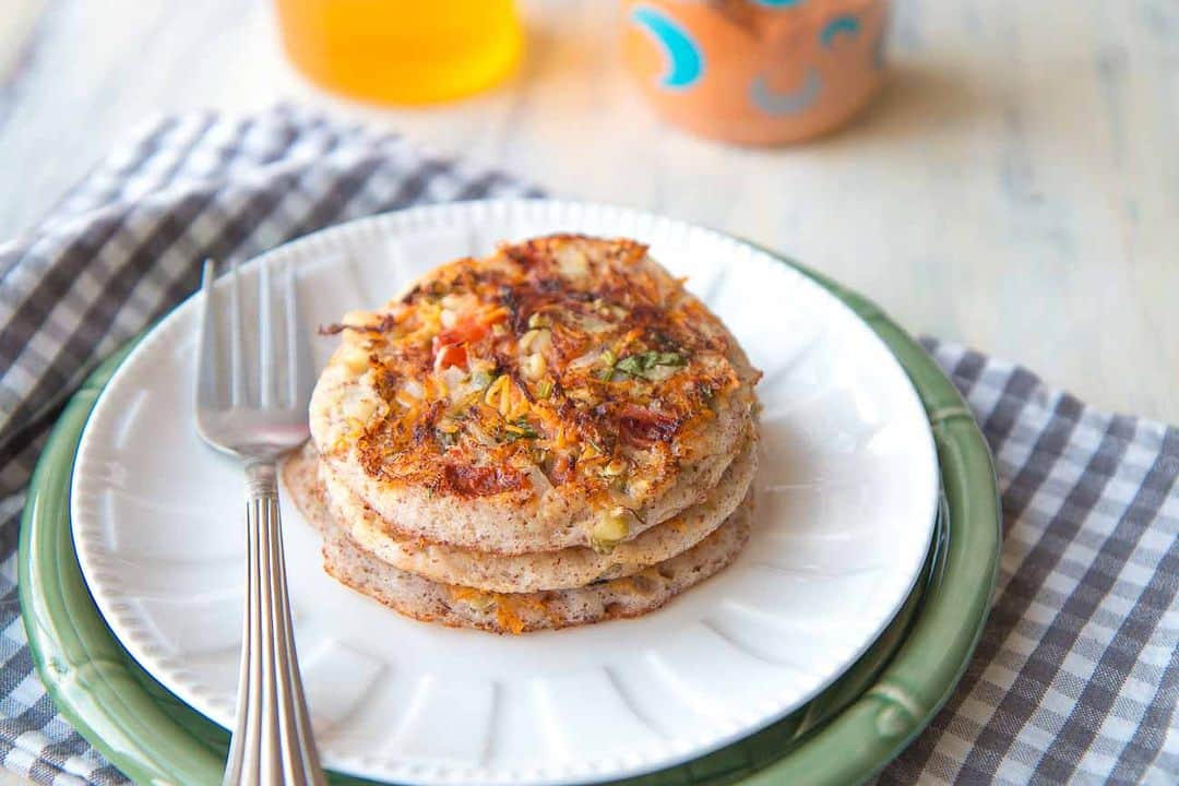 Archana's Kitchenさんのインスタグラム写真 - (Archana's KitchenInstagram)「The Vegetable Ragi & Oats Uttapam Recipe is a healthy twist to the traditional Uttapam. Try this delicious recipe for a wholesome breakfast and serve with any chutney of your choice.  Ingredients Ingredients for Dosa Batter 1/2 cup White Urad Dal 80 grams Rolled Oats Or Instant Oats 1 cup Brown Rice 1/2 cup Ragi Seeds 1 teaspoon Methi Seeds Ingredients for Vegetable Ragi & Oats Uttapam Recipe 1 cup Oats dosa batter 1 Red Bell pepper (Capsicum), finely chopped 2 Carrots (Gajjar), grated 1 Tomato, finely chopped 1 Green Chilli, finely chopped Oil, as required  👉To begin making the Vegetable Ragi & Oats Uttapam Recipe we will first make the oats dosa batter.  Method to make Dosa Batter 👉Soak the urad dal with fenugreek seeds and oats in water separately. 👉Soak the brown rice and ragi in water separately. Soak them for 5 hours. 👉After soaking grind them separately to make a thick batter in a mixer grinder. Place the batter in a large bowl and allow it to ferment for 8 hours.  Method to Vegetable Ragi & Oats Uttapam Recipe 👉Combine the topping ingredients like the carrots, capsicum, green chillies, tomatoes and keep aside. 👉Heat a dosa pan  on medium high heat; season it with oil if you are using an iron skillet. Check if the skillet is hot, you will know when you sprinkle some water and it sizzles. 👉When hot, pour a ladle full of the Oats Dosa Batter onto the skillet and just give it a slight swirl to spread it just a bit. It should be a like a thick pancake. 👉Sprinkle a generous amount of the topping over the Uttapam. Drizzle 1/8 teaspoon of oil around the Uttapam and cover if you have a lid, else you can let it c👉ook in the open. 👉Once you notice the top is lightly steamed and the batter is not raw, press the filling down with a flat spatula. Then flip the Uttapam to cook on the other side. 👉Turn the heat to medium high, so the vegetables cook fast. After about 30 to 40 seconds flip again and the Uttapam will be ready to be served. 👉Serve the Vegetable Ragi & Oats Uttapam along with a Spicy Peanut Chutney for breakfast or a weeknight dinner.」5月5日 11時30分 - archanaskitchen
