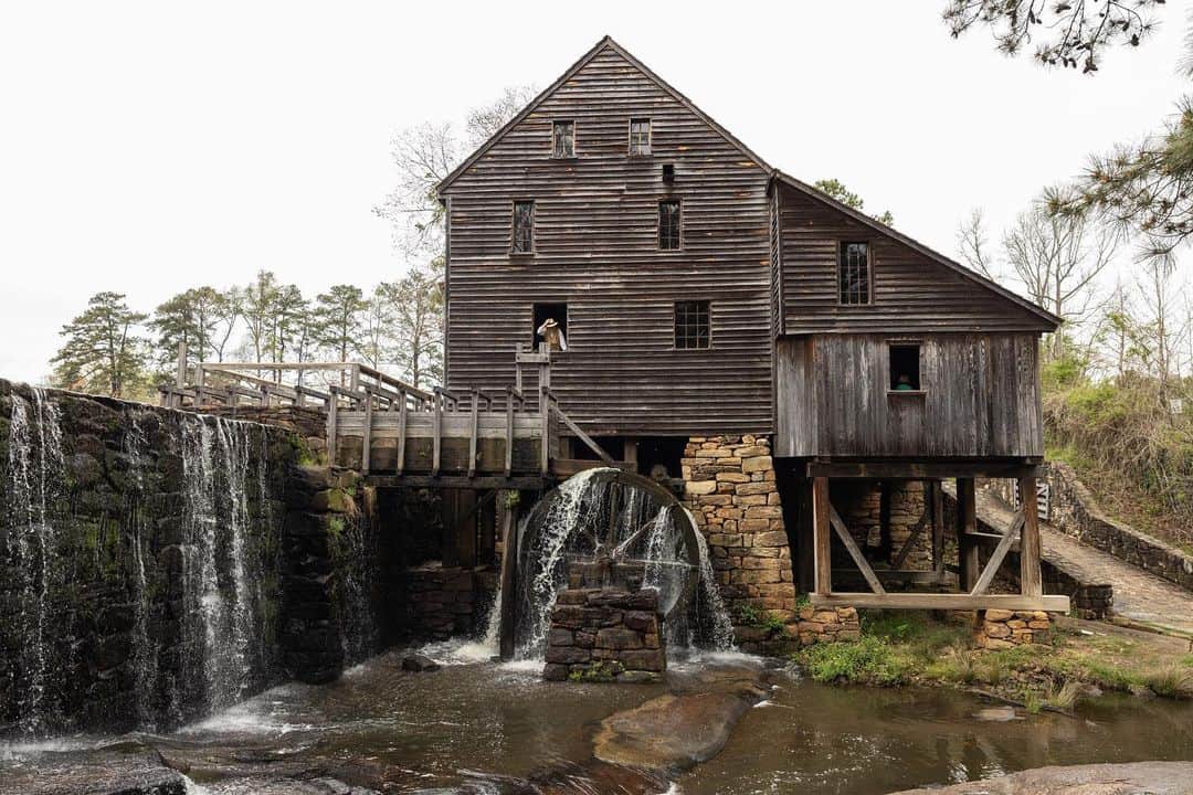 National Geographic Travelさんのインスタグラム写真 - (National Geographic TravelInstagram)「Photo by @gretarybus | William Robbins, a volunteer at the Historic Yates Mill County Park in Wake County, North Carolina, checks the water-powered mechanisms of the gristmill. Every third Saturday, the park hosts live demonstrations, and historical reenactments show how corn was processed as far back as 1756. I met a volunteer in a soft gingham dress and bonnet typical of the 18th century, and Robbins showed me and other visitors how quickly the mill turned corn into a fine cornmeal. Just a few miles south of Raleigh, the park spans 174 acres (70 hectares) and includes gardens, exhibits, walking trails, fishing, and animal habitat. | Uncover over 200 years of history preserved in the North Carolina Piedmont. Authentic landmarks like the Yates Mill County Park are anything but traditional for any traveler to experience.」5月6日 4時14分 - natgeotravel