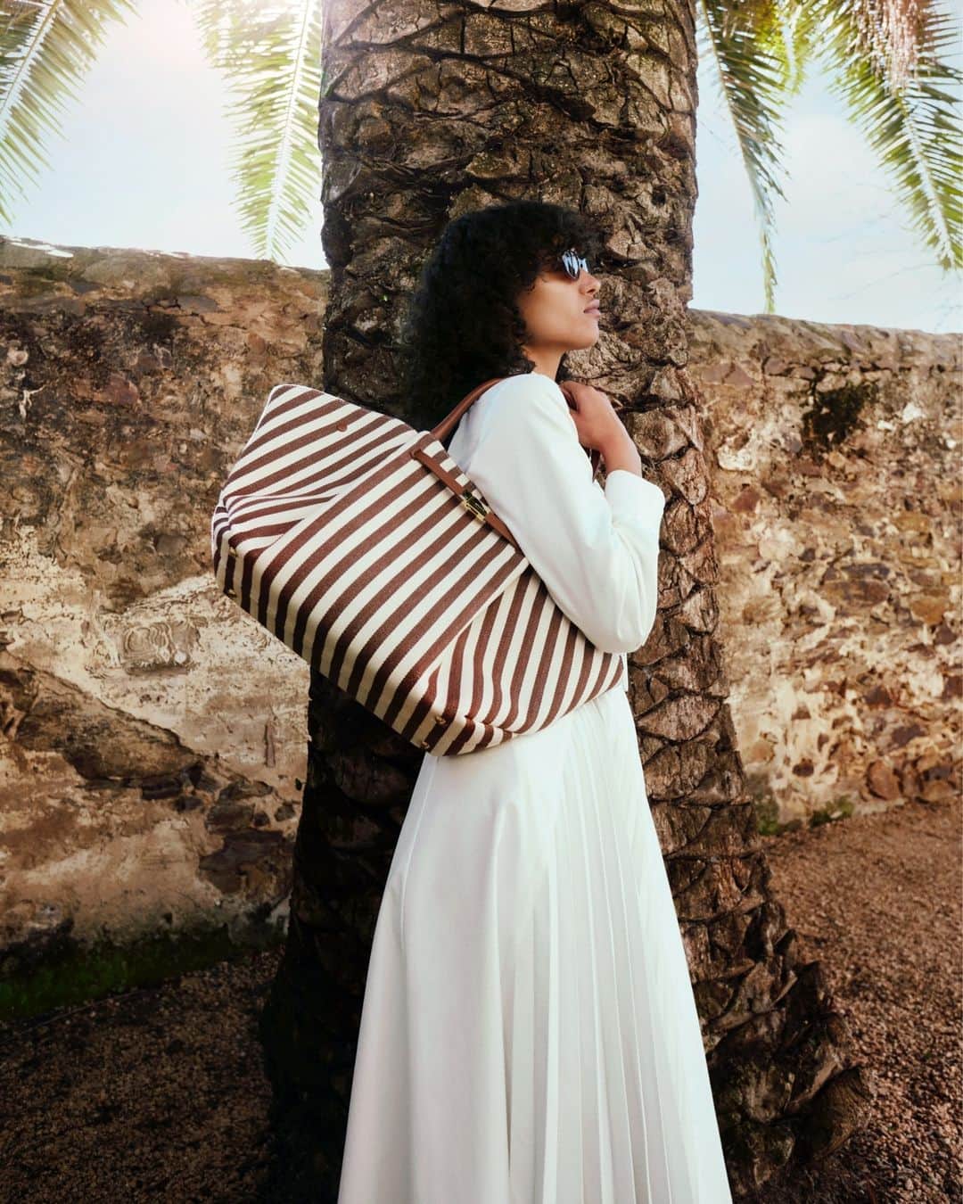 MATCHESFASHION.COMさんのインスタグラム写真 - (MATCHESFASHION.COMInstagram)「Exclusive bags at #MATCHES: @demellierlondon. The New York bag is fast becoming a DeMellier signature. Amp up your arm candy with this brown and white striped canvas iteration.  Tap to shop.」5月6日 18時00分 - matches